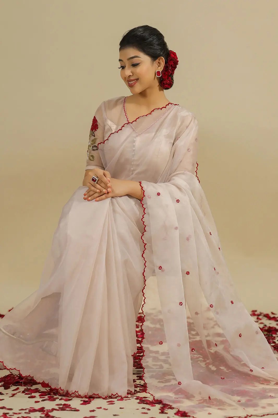 a woman in white silk organza saree