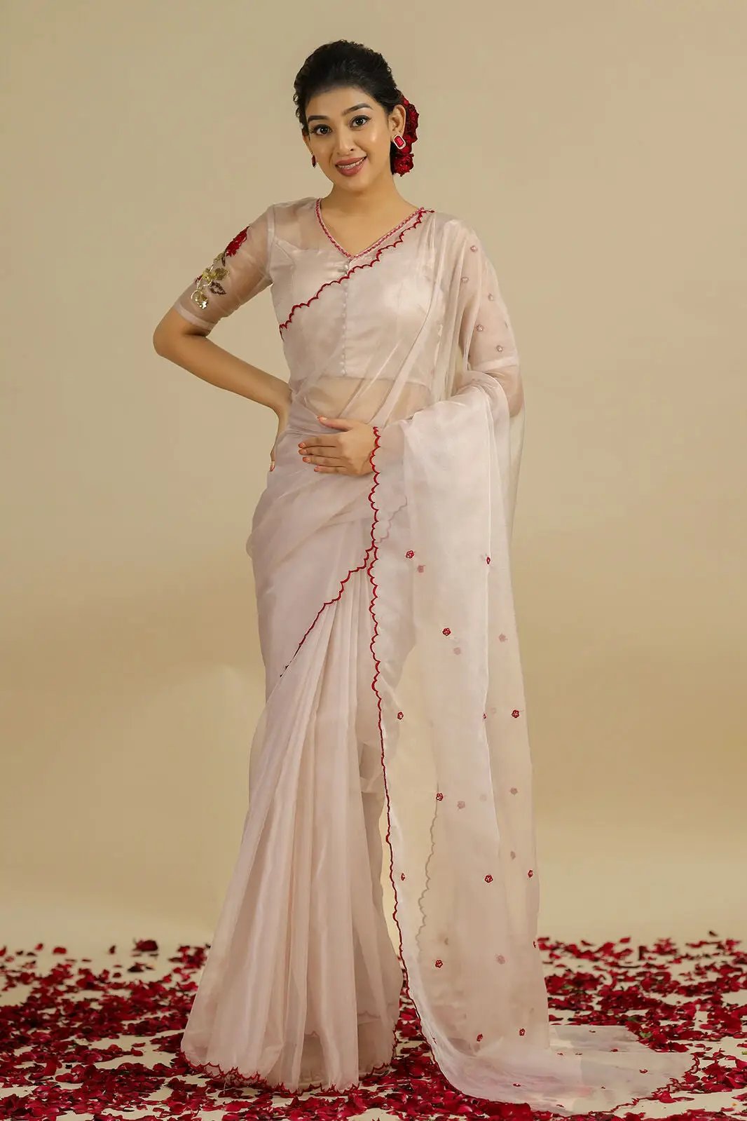 a woman in ivory saree