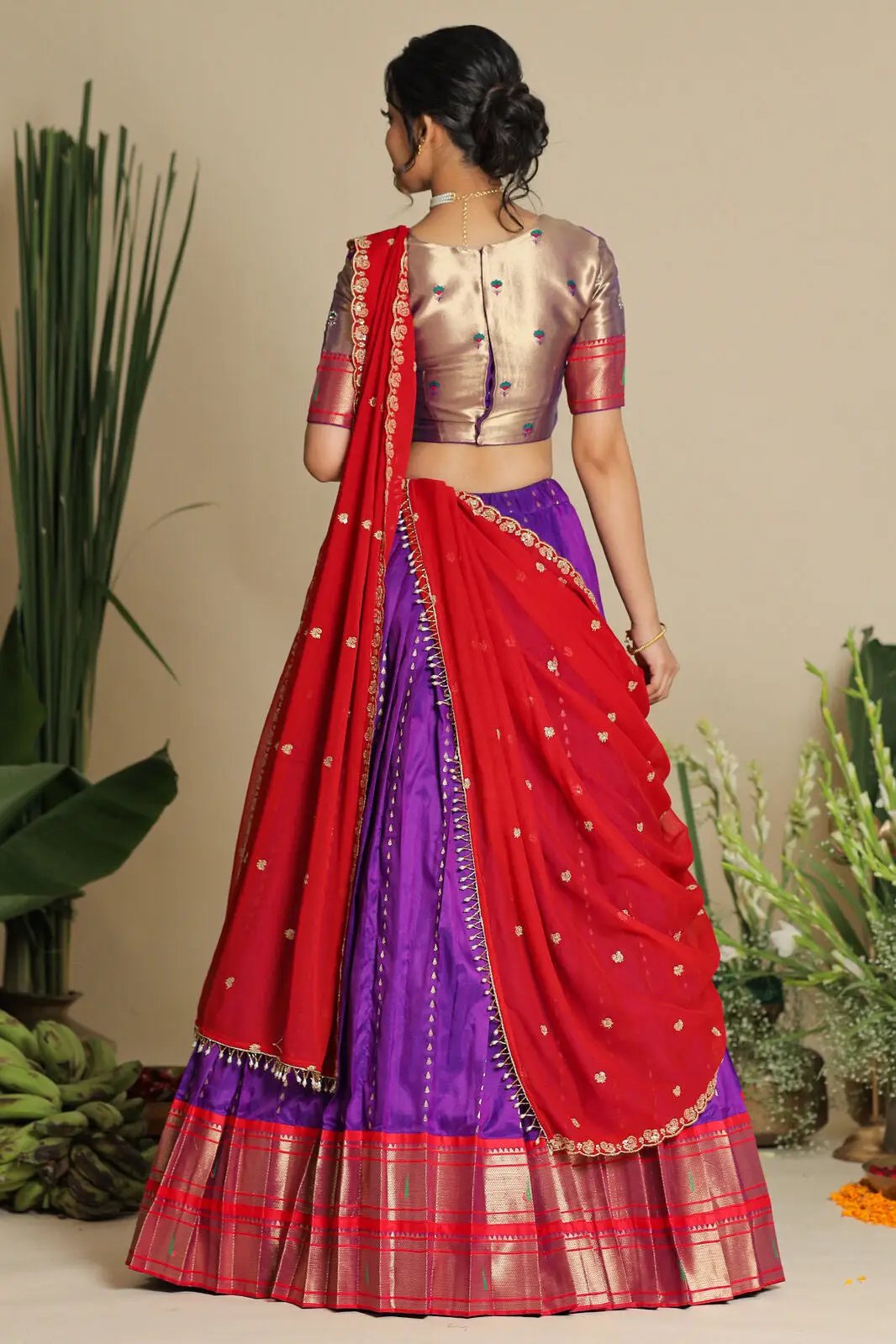 Back view of purple lehenga set with red dupatta