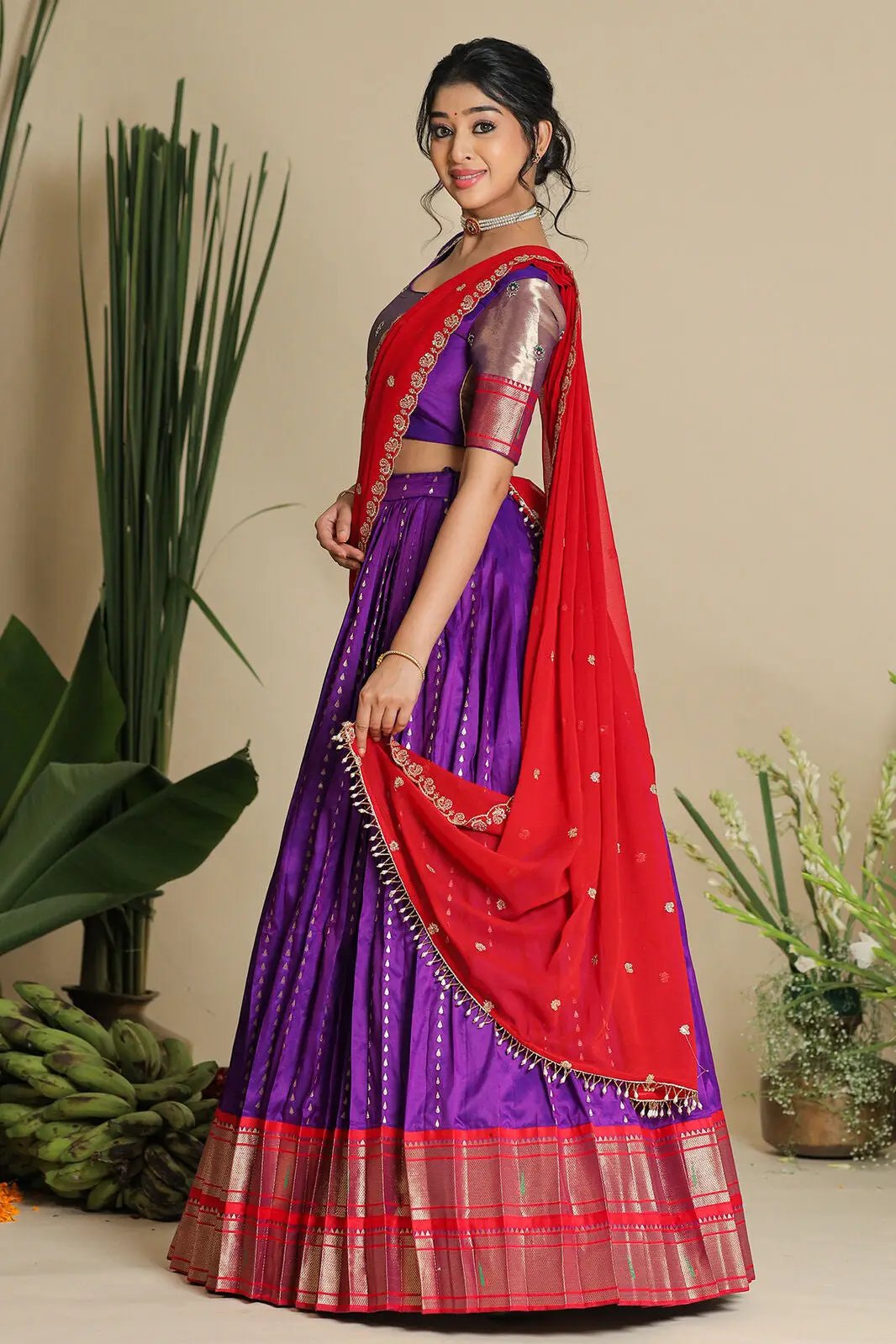 Side view of purple lehenga with red dupatta