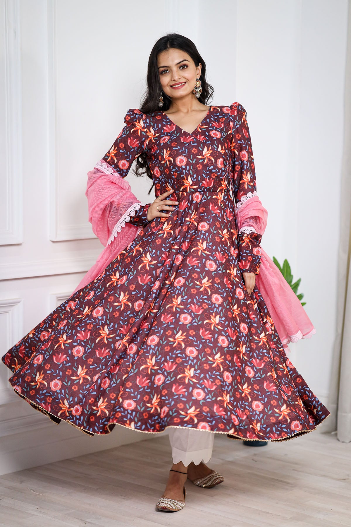 a woman in brown long dress and peach dupatta