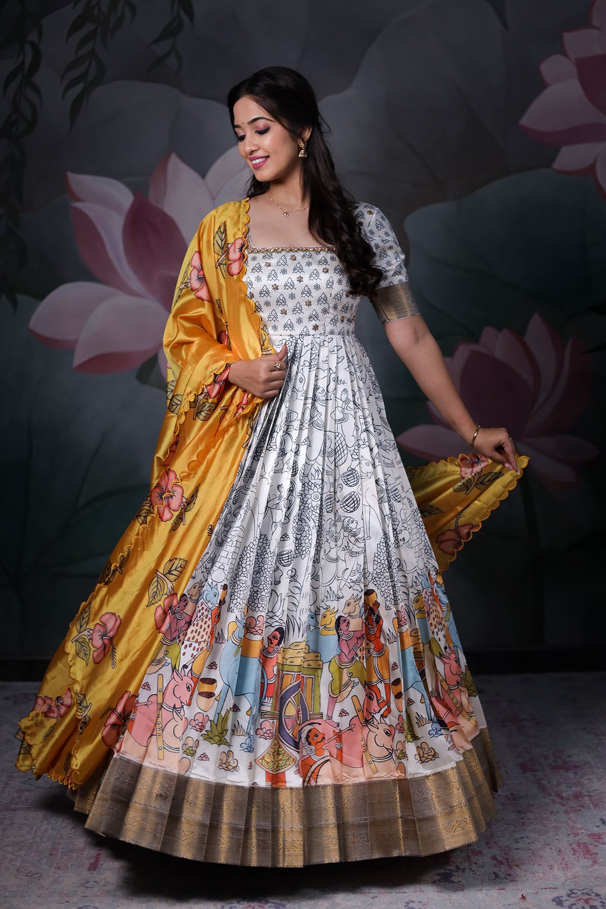 a woman in off white banarasi dress