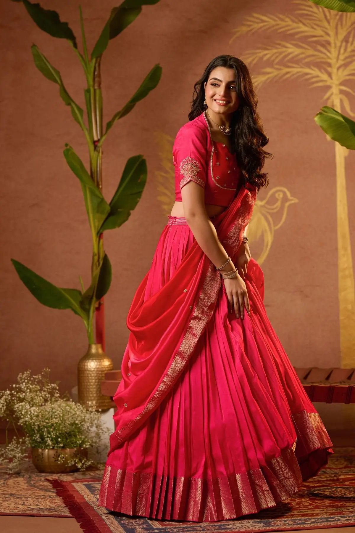 Twirl-ready Pritti Lehenga Set in Rani Pink with a voluminous flare and exquisite detailing, perfect for festive and wedding occasions.