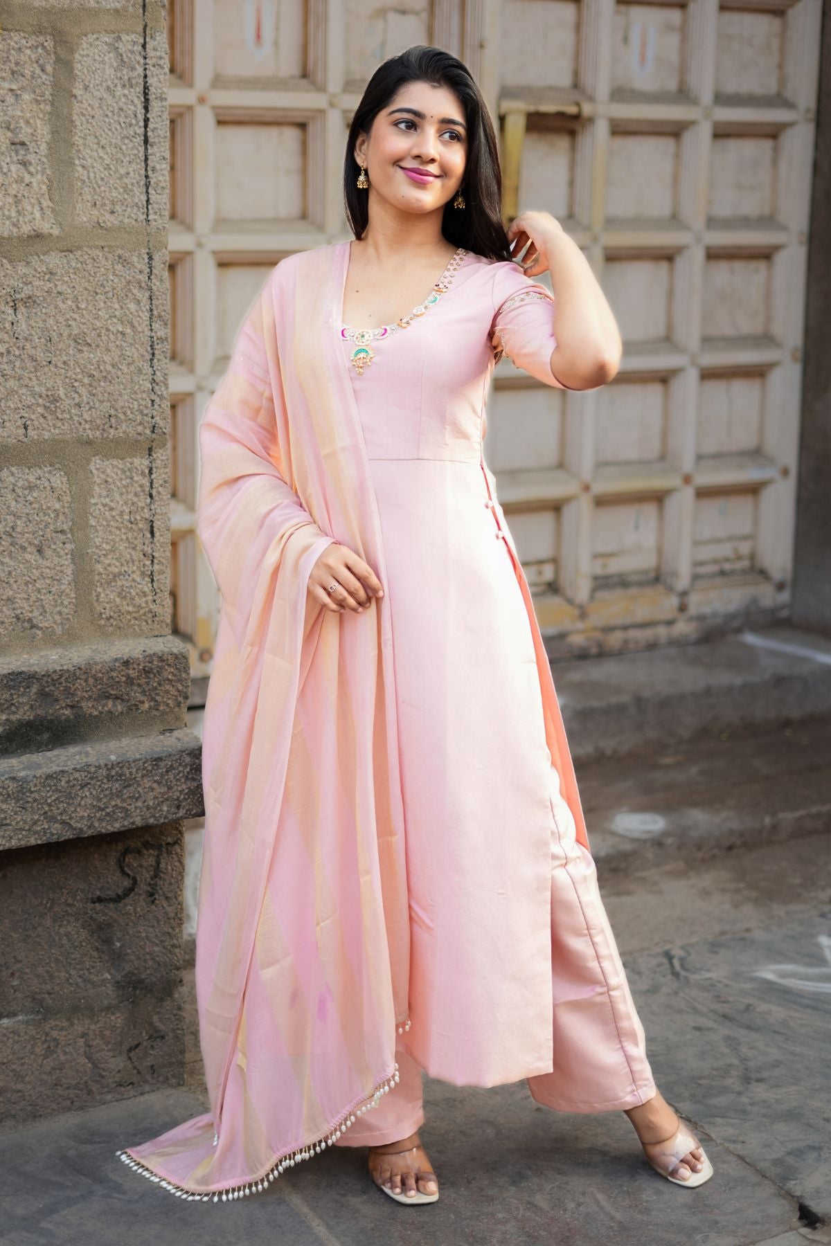 Noor Jadau Kurta Set in peach with intricate jadau work, paired with matching pants and a flowy dupatta, perfect for festive occasions.