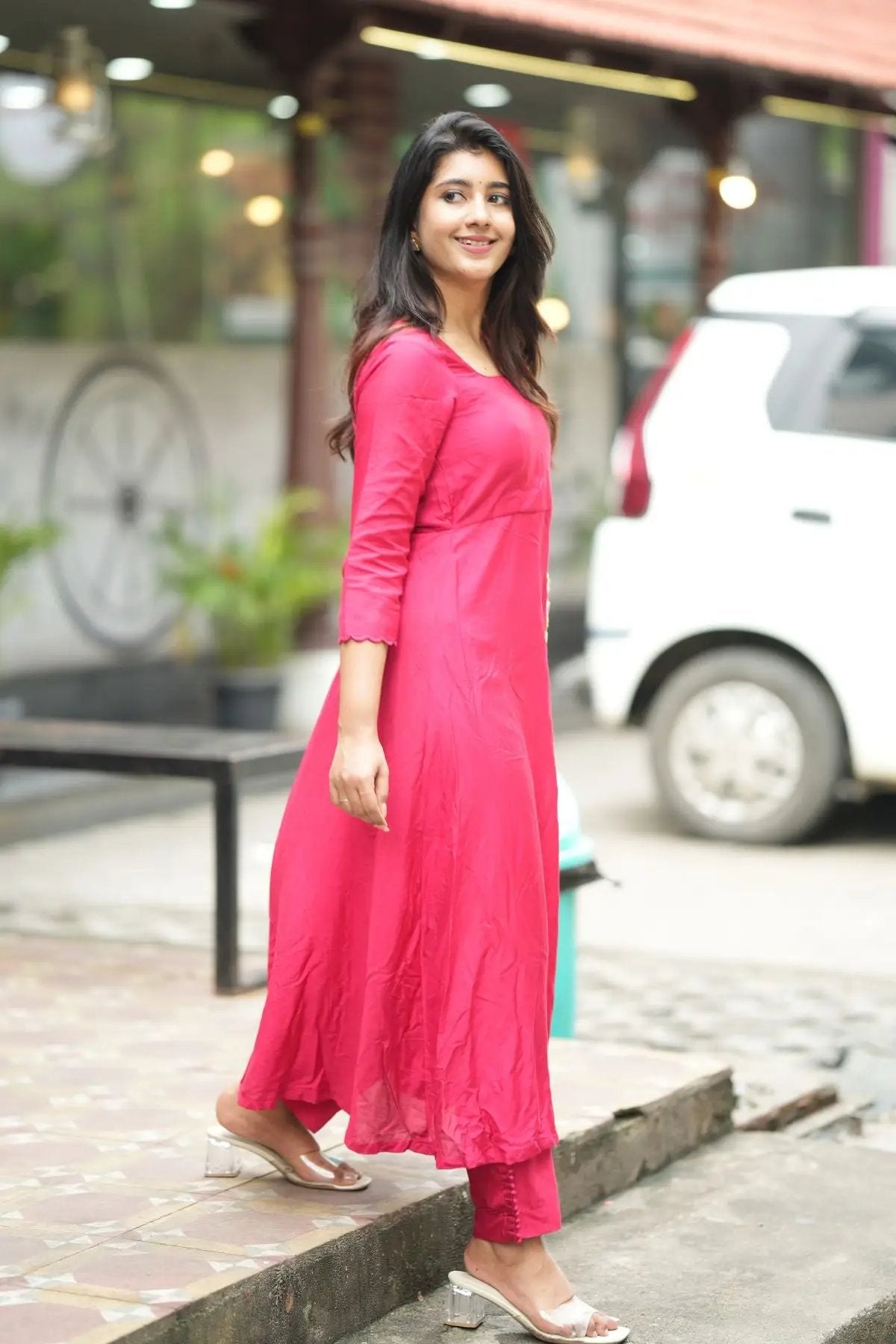 Full-length view of the Rasha Kurta Set in Raspberry, designed with a flowy silhouette and comfortable muslin fabric for all-day wear.