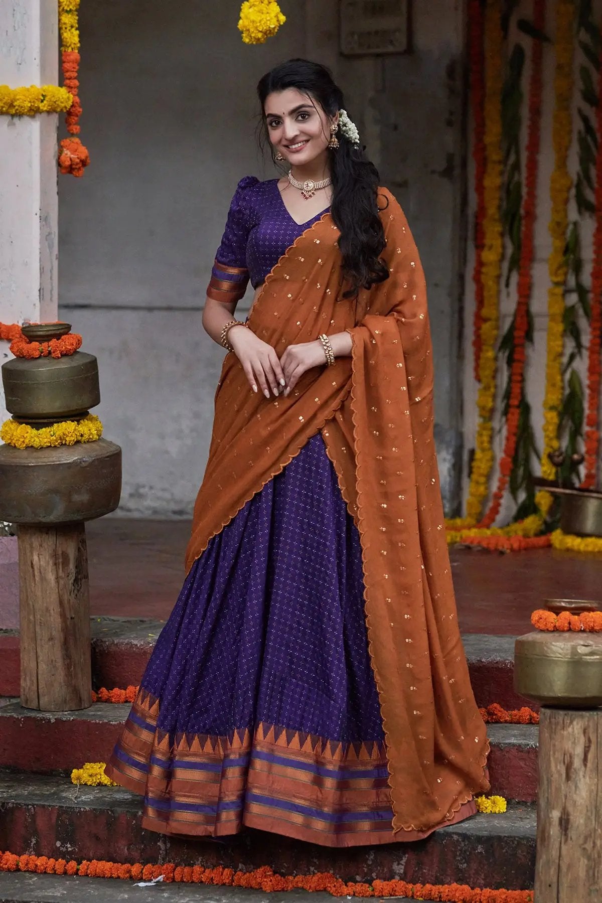 Akhila Naraynpet Lehenga Set in dark purple with orange dupatta