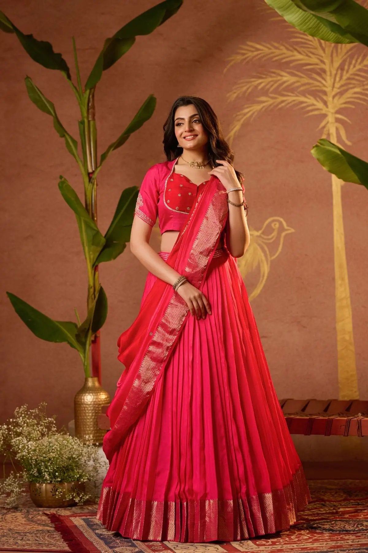 Traditional Pritti Lehenga Set in Rani Pink with a beautifully pleated skirt and embroidered blouse, exuding elegance and charm.