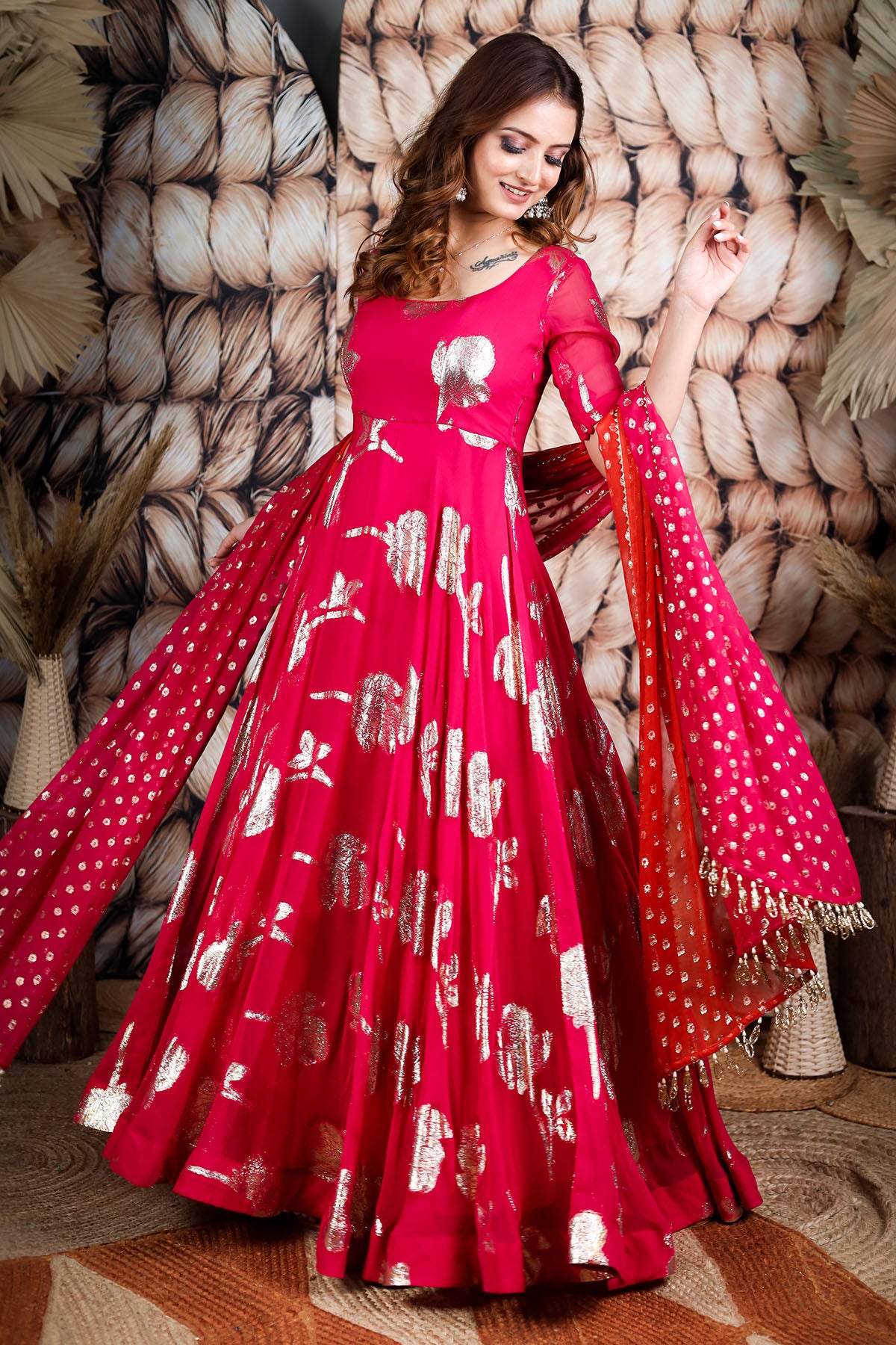 a woman in red anarkali suit