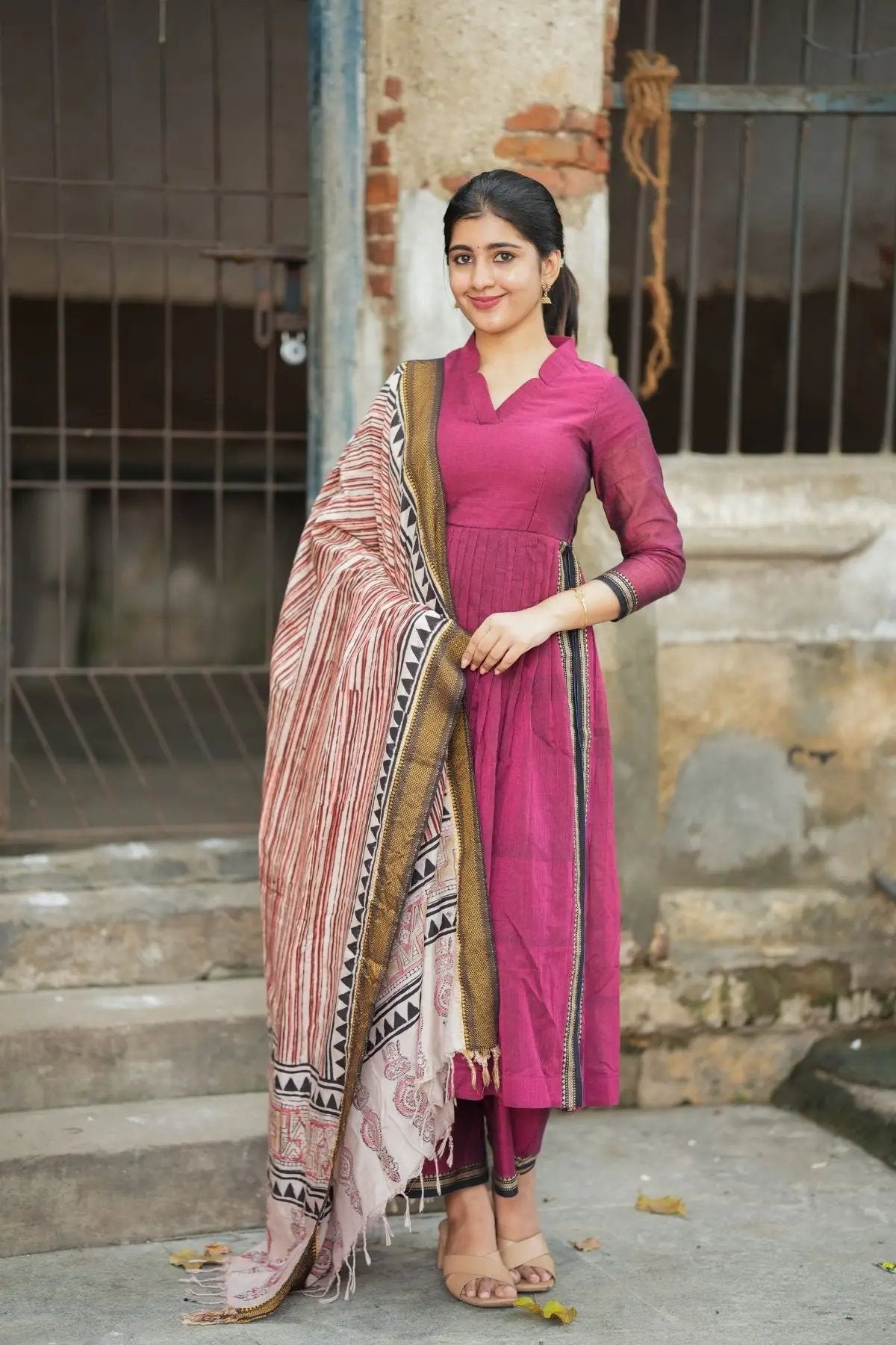 Exclusive Kasturi Handloom Kurta Set in maroon with intricate detailing, paired with a printed dupatta. Perfect for traditional and festive wear.