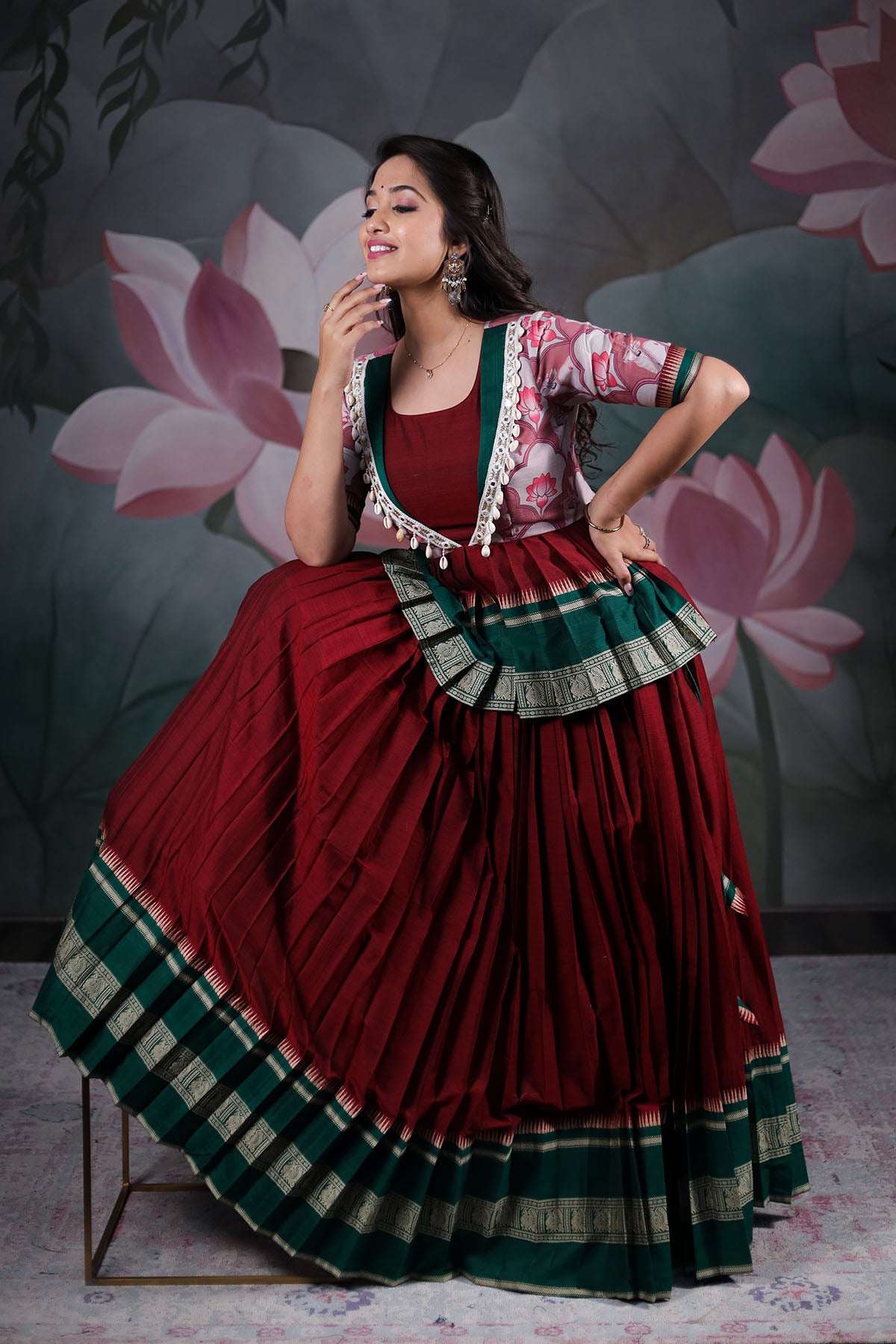 a woman in maroon long dress