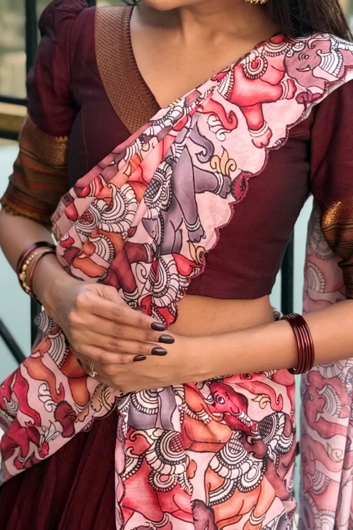 Close-up of Saumya Handloom Lehenga Set in maroon showcasing the detailed floral printed dupatta and elegant blouse design.