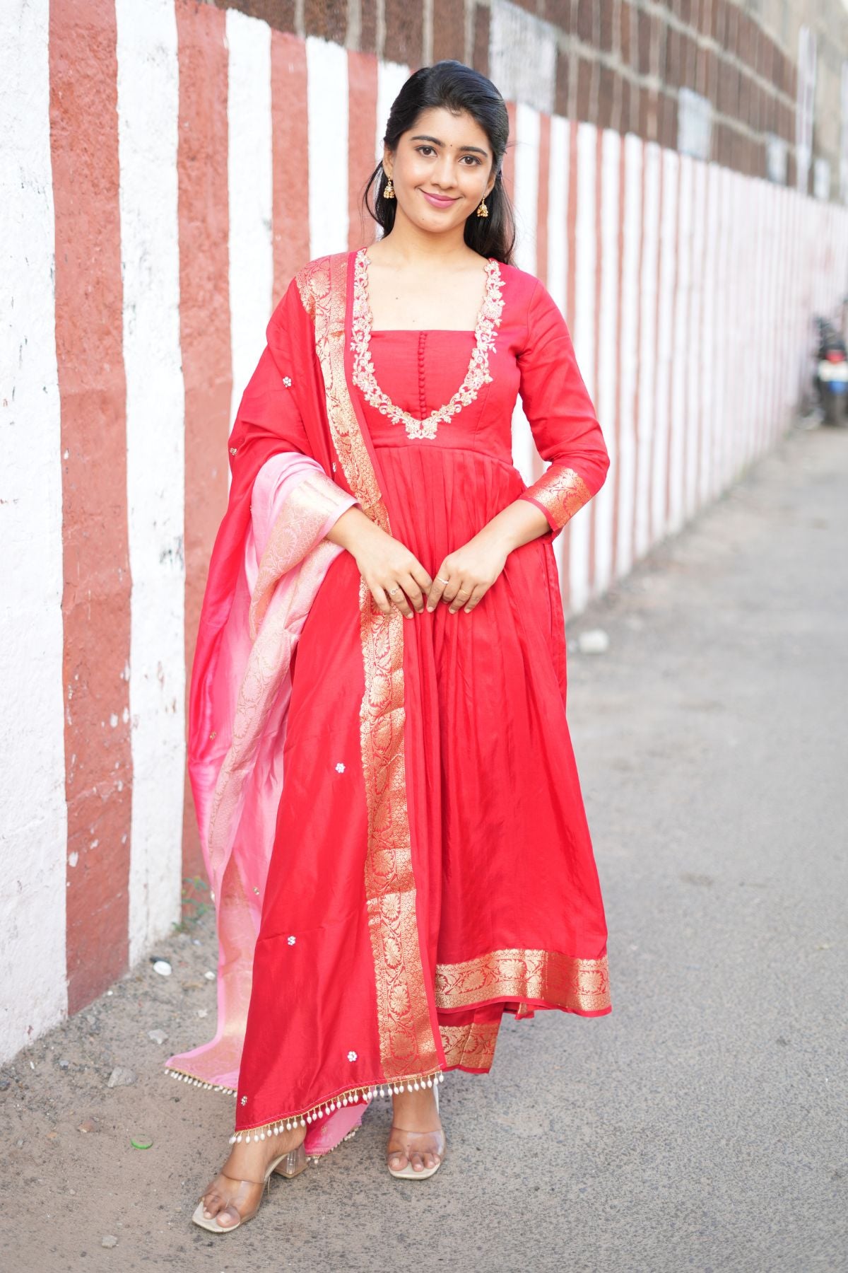 Exclusive Madhubala Silk Kurta Set in Red with intricate embroidery and Banarasi border, paired with a pink dupatta. Perfect ethnic dress for festive wear.