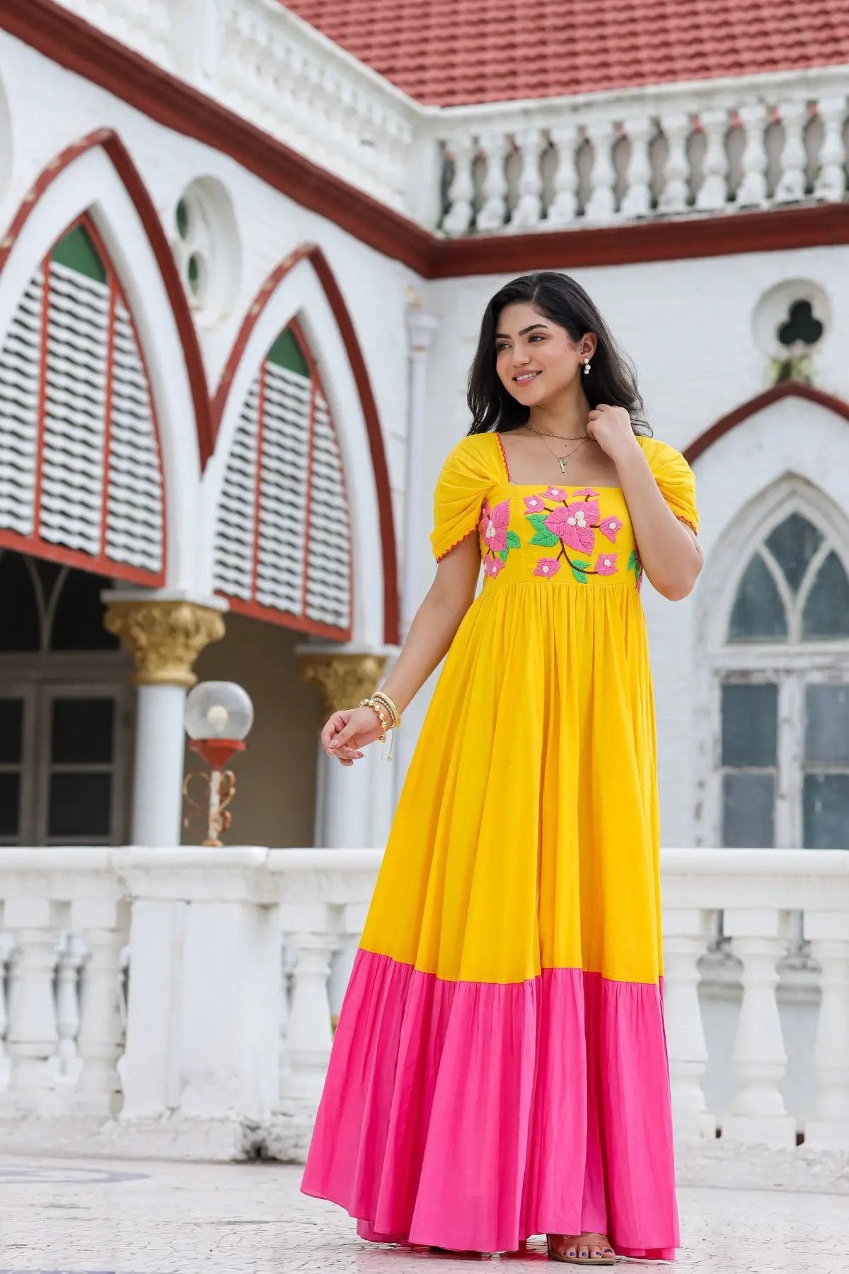 Model wearing vibrant yellow and pink Daffodil Dream Maxi Dress