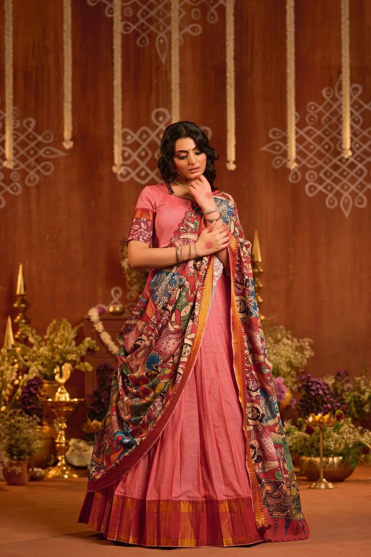 Traditional Parinita Lehenga Set in Peach, showcasing a scalloped kalamkari dupatta and pleated cotton skirt for a regal ethnic look.