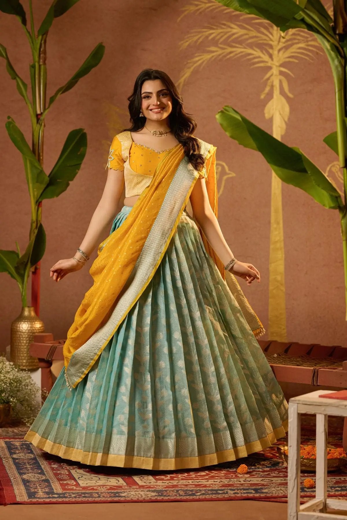 Exclusive Aadhya Lehenga Set in Yellow with blue pleated skirt and embroidered blouse, perfect for traditional occasions. Shop now at bullionknot.