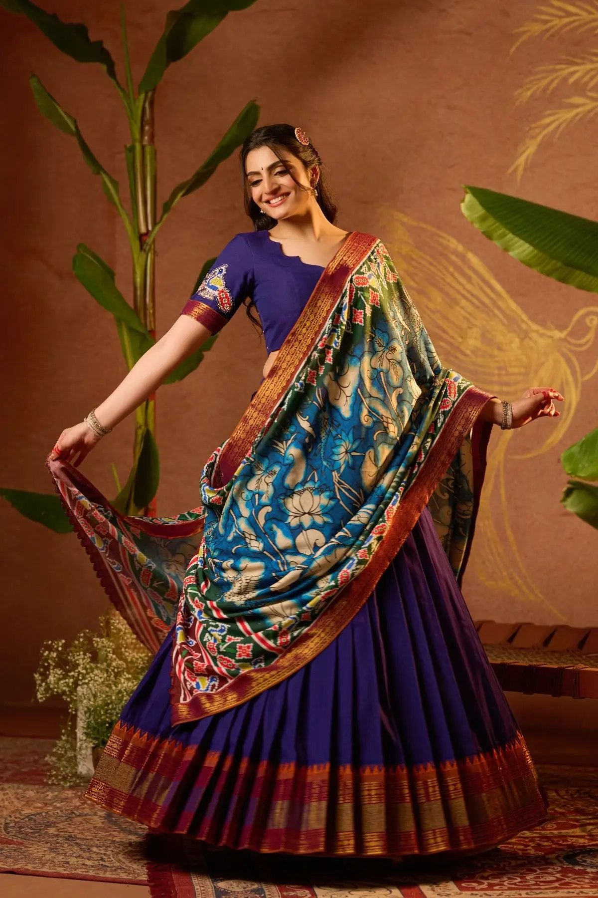 Shloka Kalamkari Lehenga Set in Blue with a flowing silhouette, featuring vibrant handloom patterns.