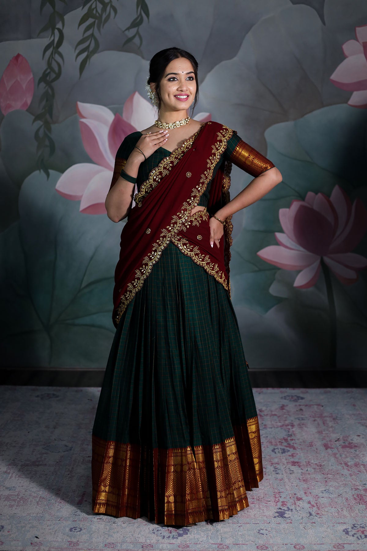 a woman in bottle green handloom lehenga set