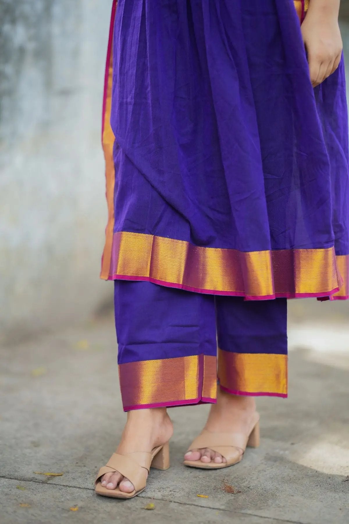 Detailed view of purple handloom suit set pants and hem