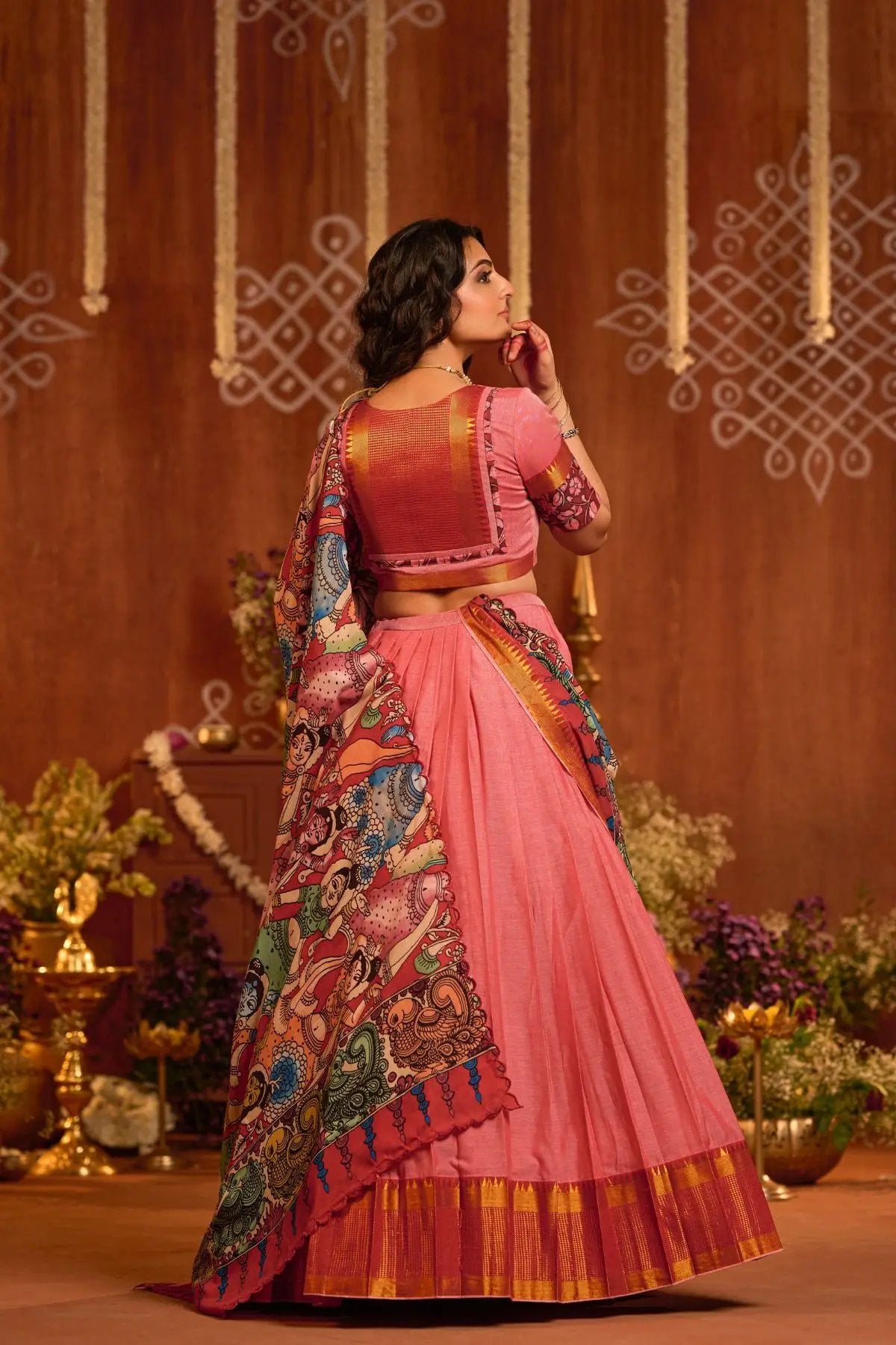 Back view of the Parinita Lehenga Set in Peach, highlighting the intricate kalamkari dupatta and elegant blouse design for a stunning ethnic appeal.