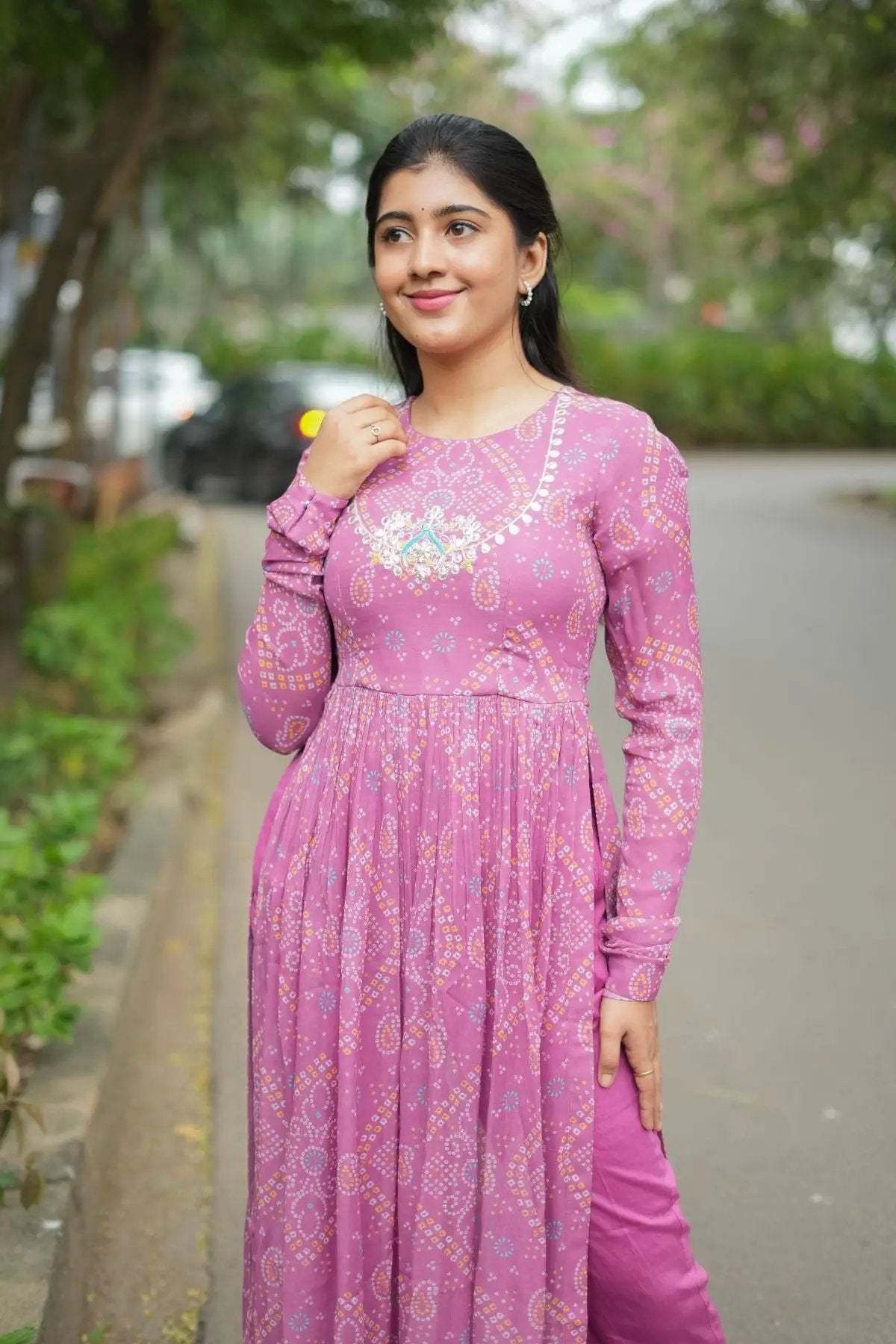 Model wearing Pragati Kurta Set in Pink, featuring a flowy silhouette with intricate detailing, perfect for formal and festive occasions.