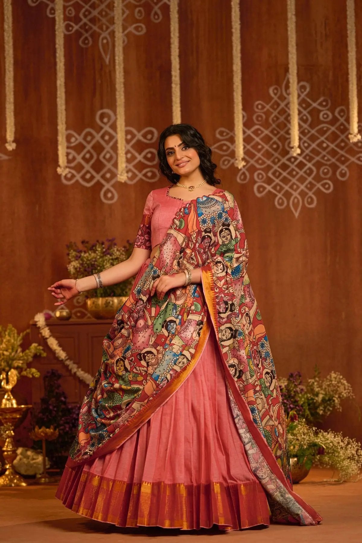 Graceful Parinita Lehenga Set in Peach with a beautifully designed blouse and artistic kalamkari dupatta, ideal for festive celebrations.