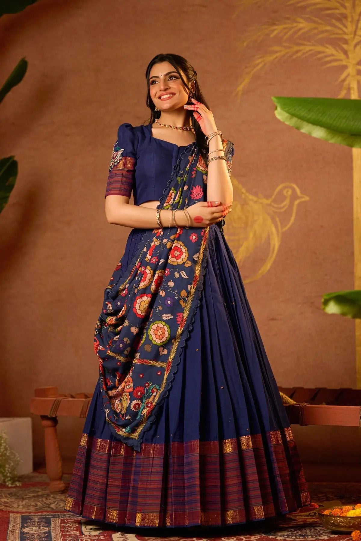 Exclusive Mrigmallika Lehenga Set in Blue with intricate peacock maggam work, a kalamkari dupatta, and a pleated 5m skirt. Perfect for any occasion.