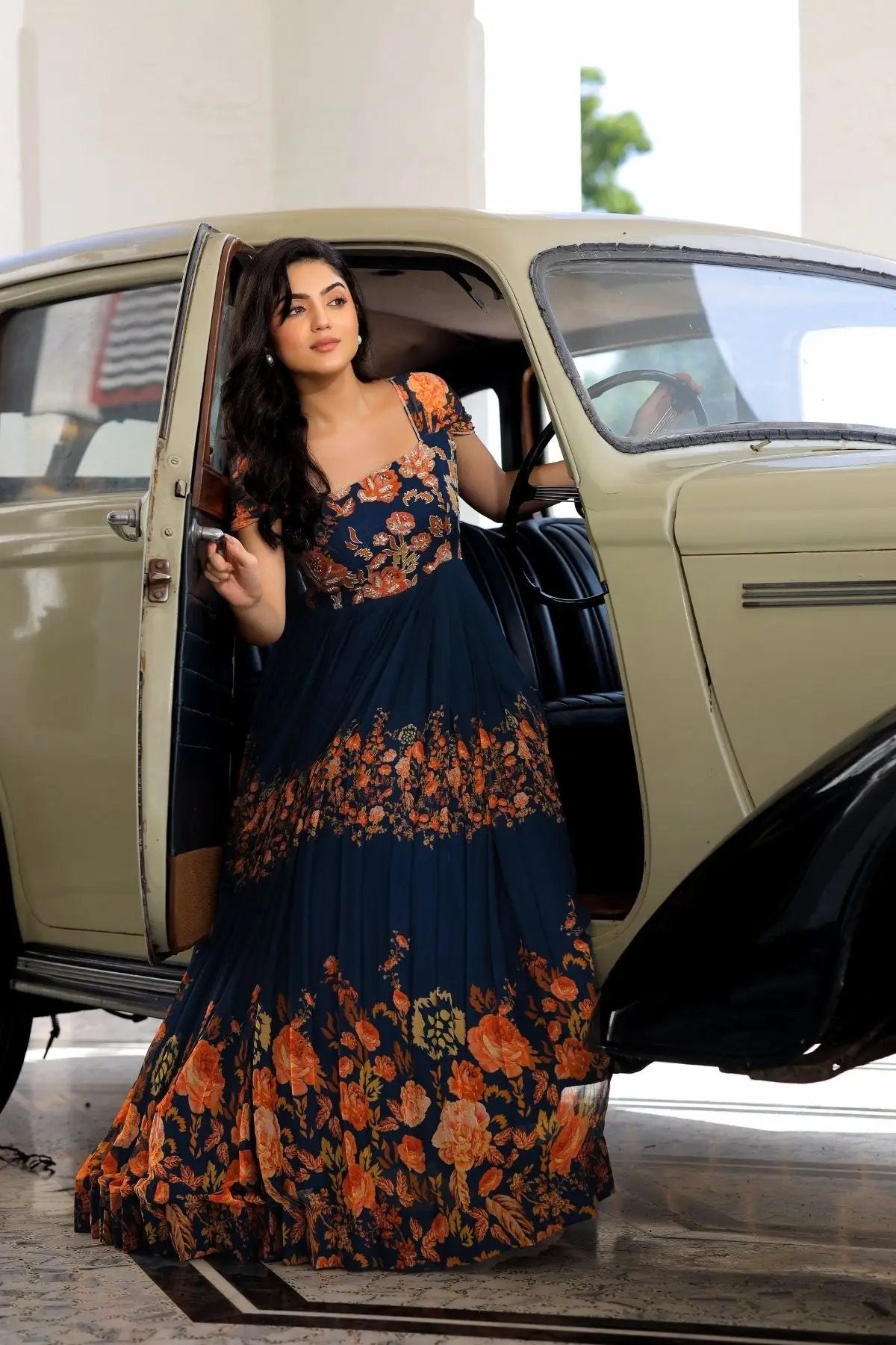 Zarna Maxi Dress in Navy Blue with floral design by vintage car