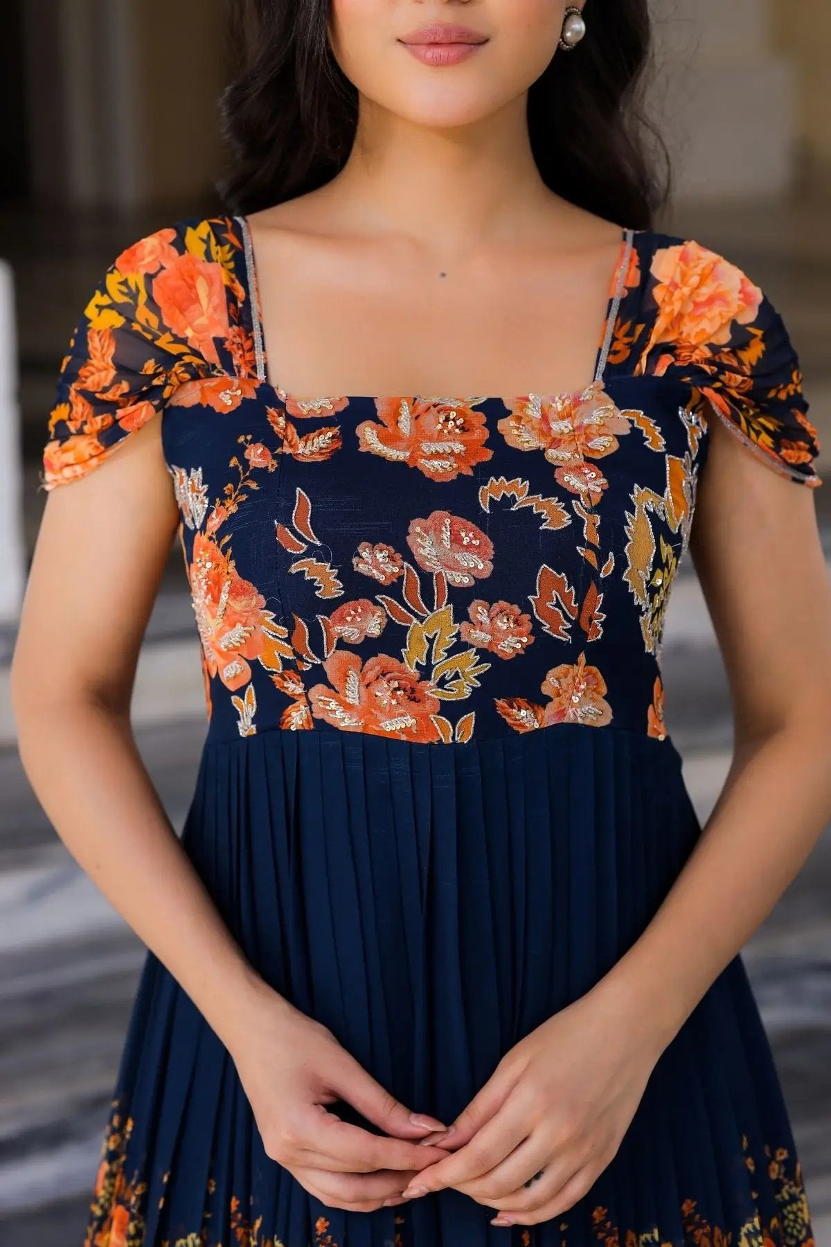 Close-up of Zarna Maxi Dress in Navy Blue with orange floral design