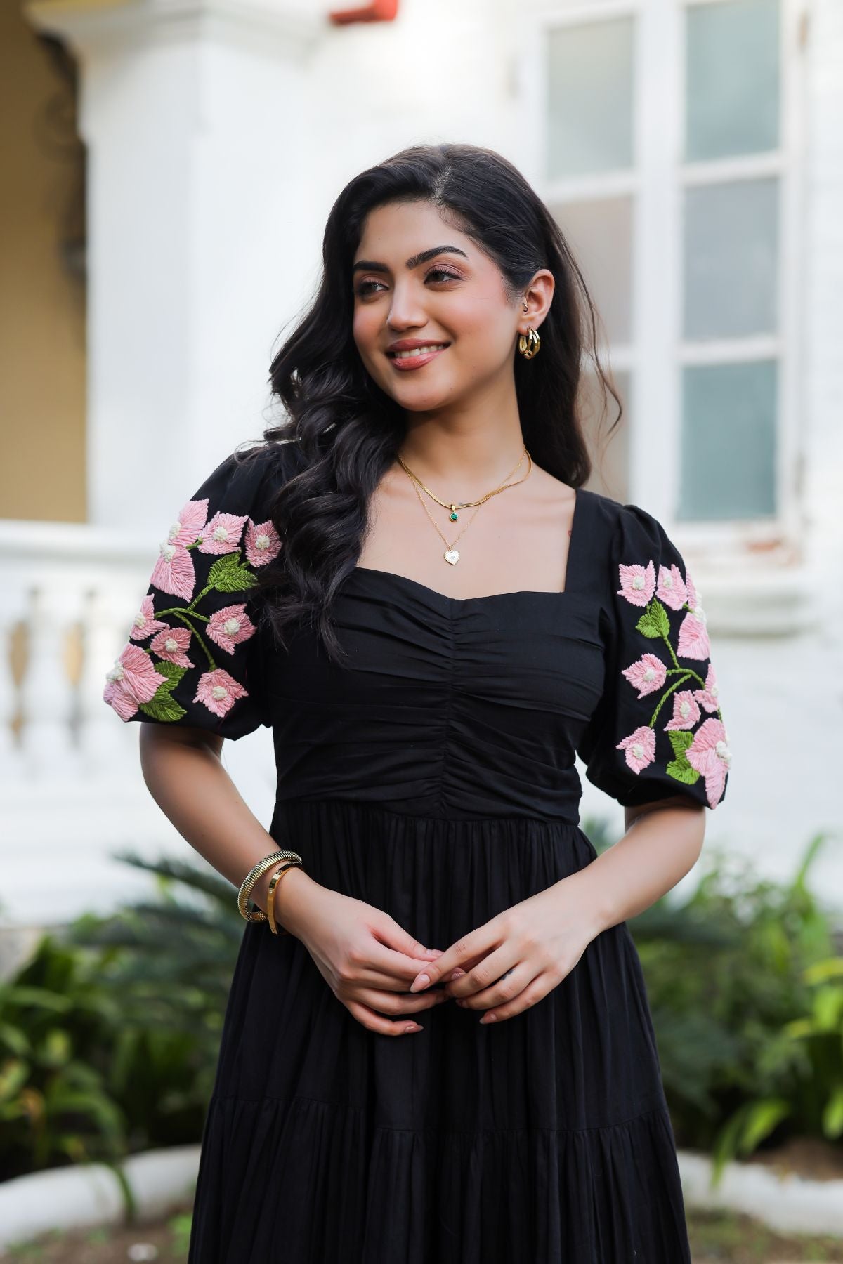 Elegant black maxi dress with pink floral accents