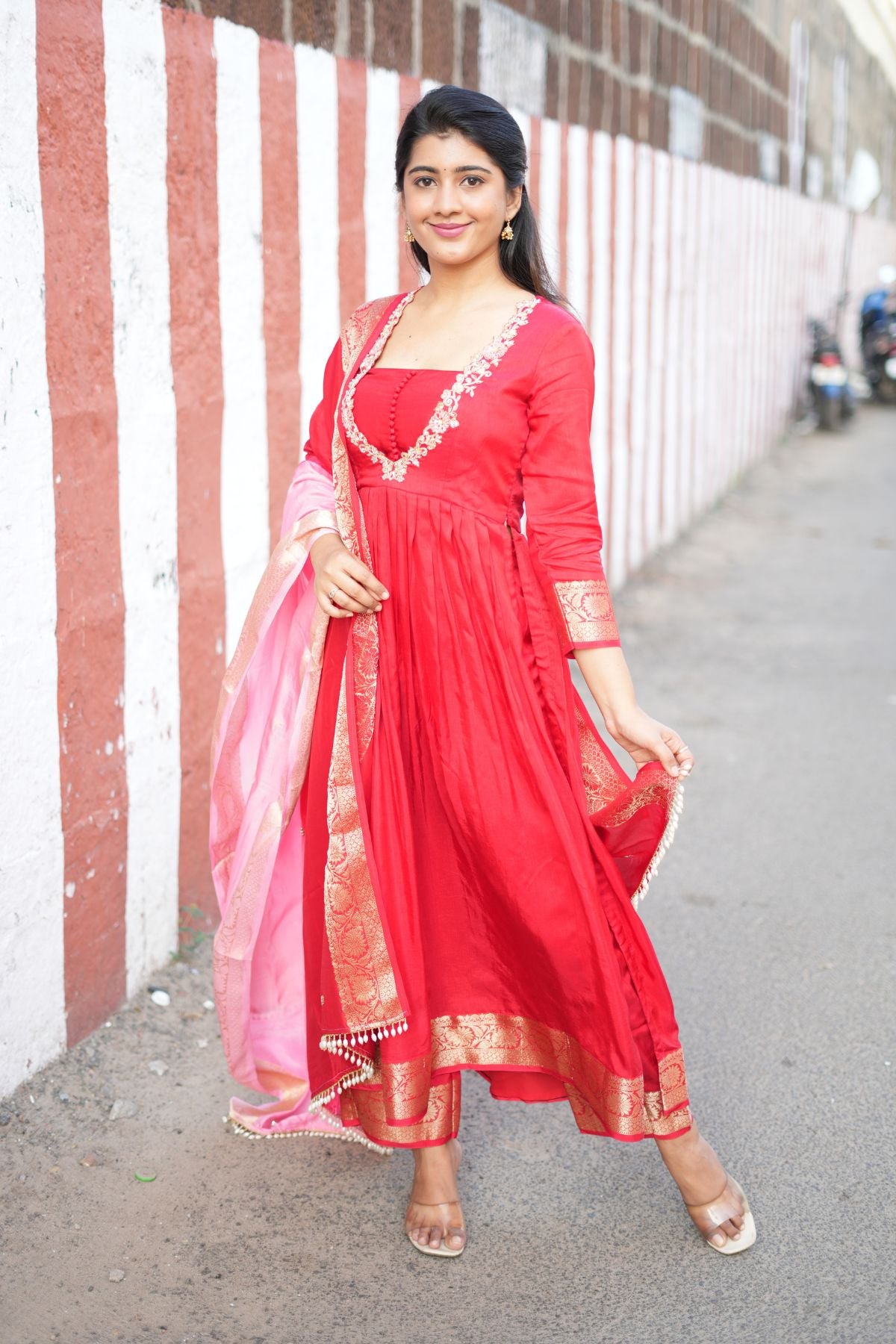 Graceful Madhubala Silk Kurta Set in Red, featuring a flared silhouette and golden Banarasi detailing. A must-have ethnic dress for traditional celebrations.