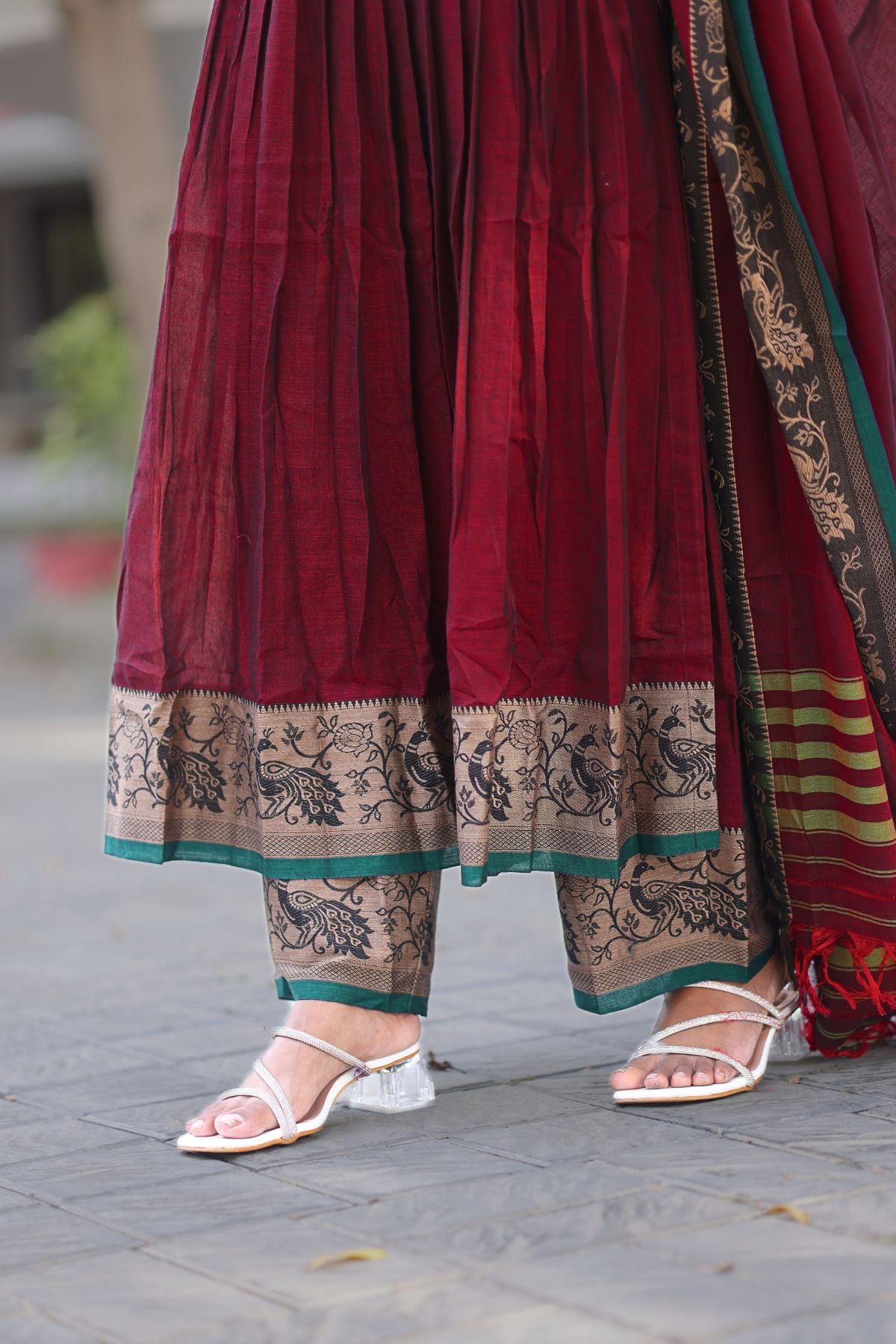 Detailed view of the Ruhana Kurta Set in maroon, highlighting the embroidered hem and matching pants. Shop this elegant set at bullionknot.