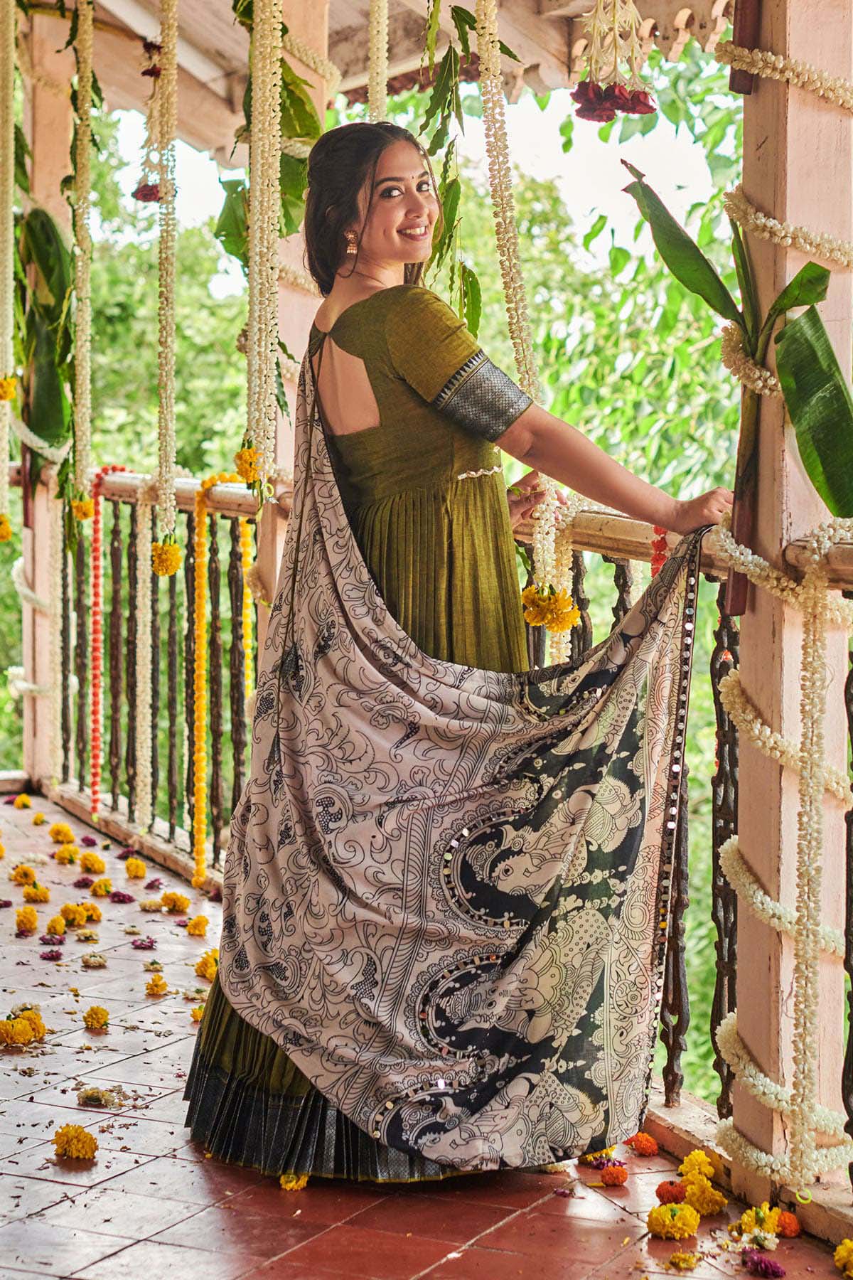 a woman in green handloom dress