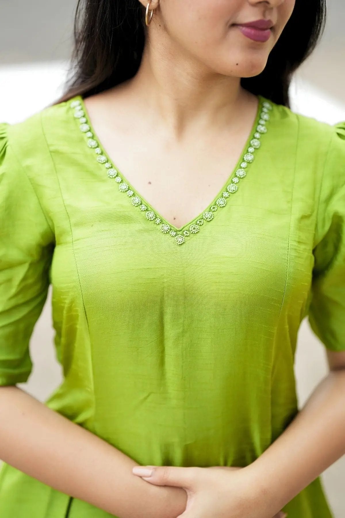 Close-up of the Sundar Kurta Set in Green highlighting the delicate embroidered neckline. A perfect blend of tradition and modern fashion.