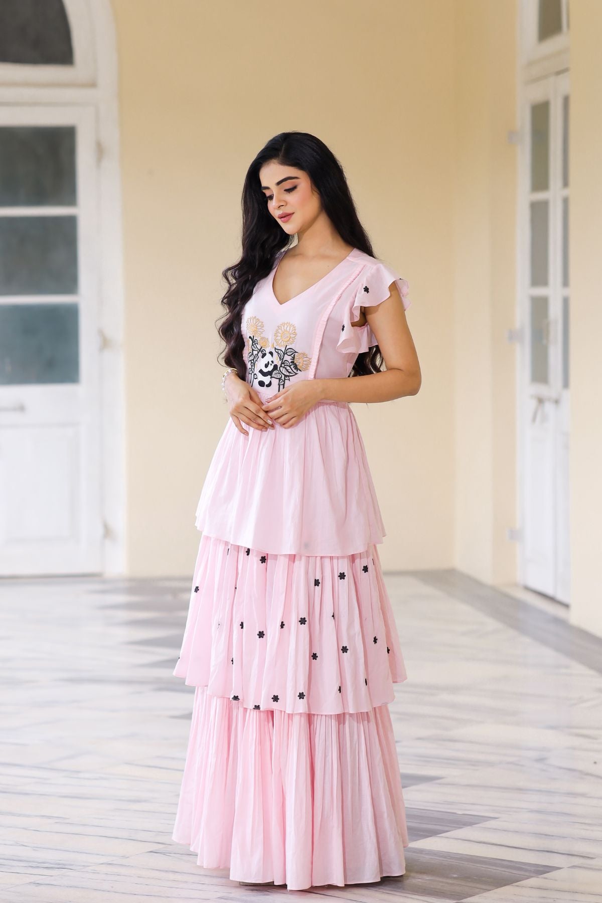 Pink maxi dress with floral embroidery and tiered design