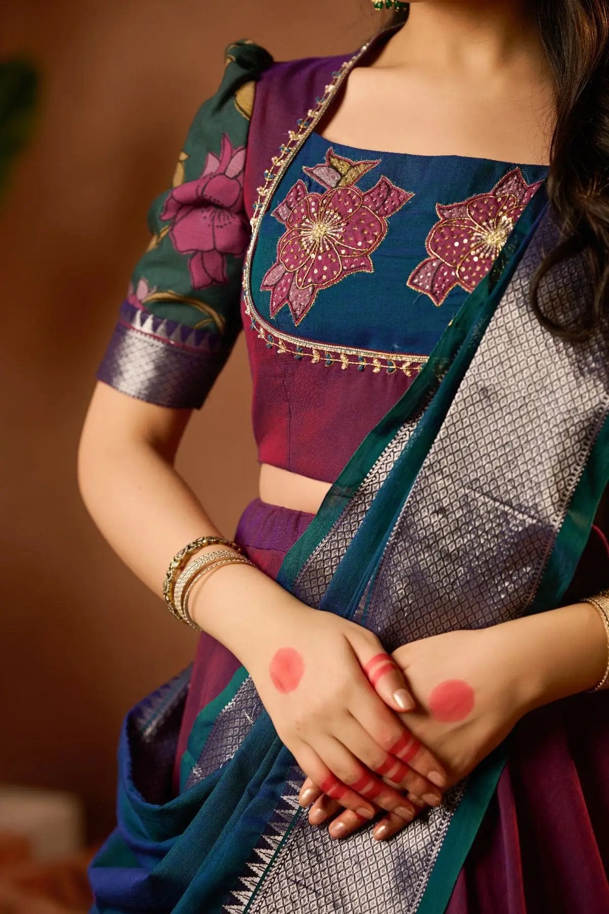 Close-up of Vamika Lehenga Set in Wine, showcasing a beautifully embroidered blouse and rich fabric. Ideal for traditional occasions.