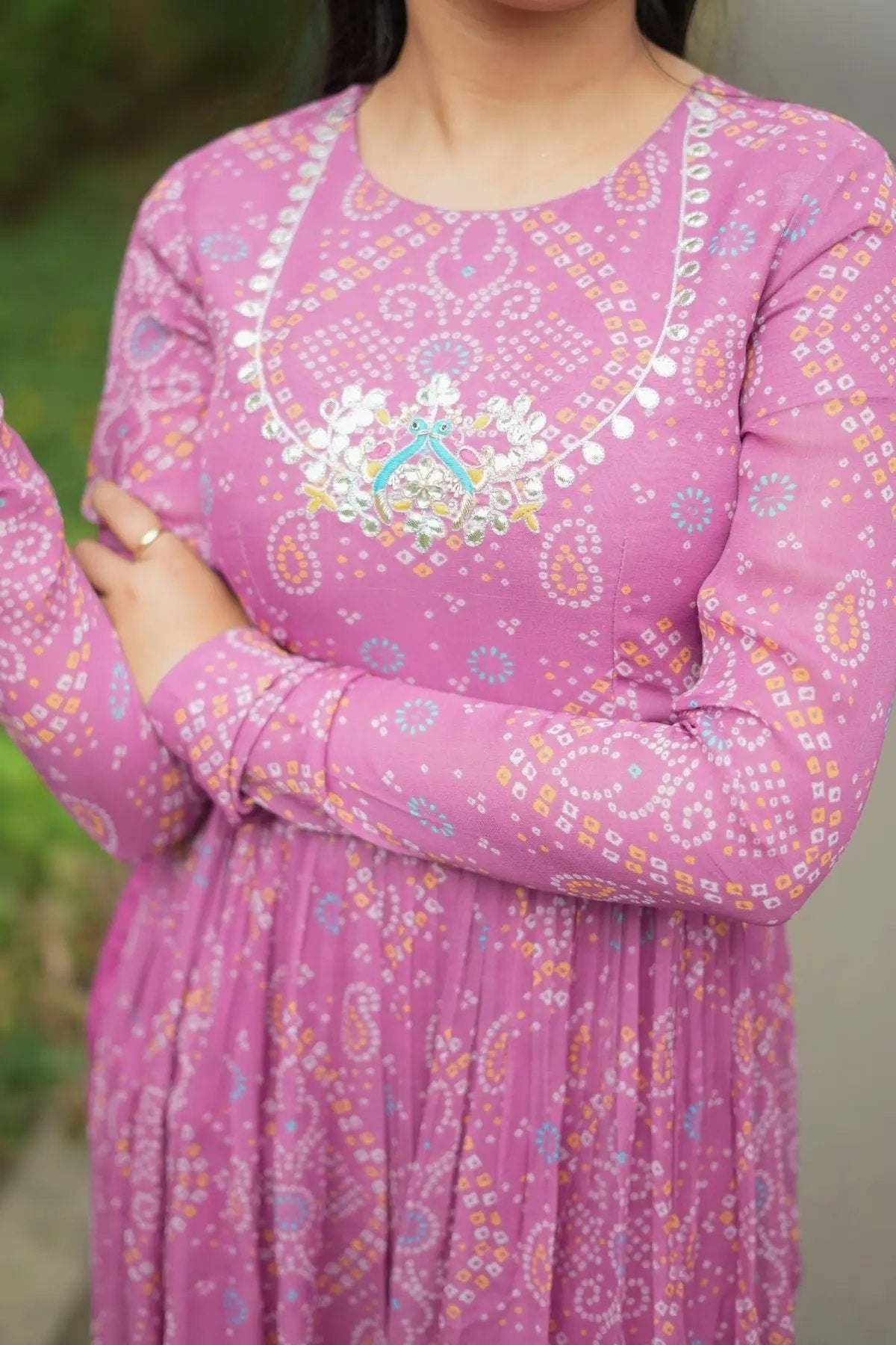 Close-up of Pragati Kurta Set in Pink showcasing delicate gota patti handwork on the neckline with elegant bandhej print for a festive look.