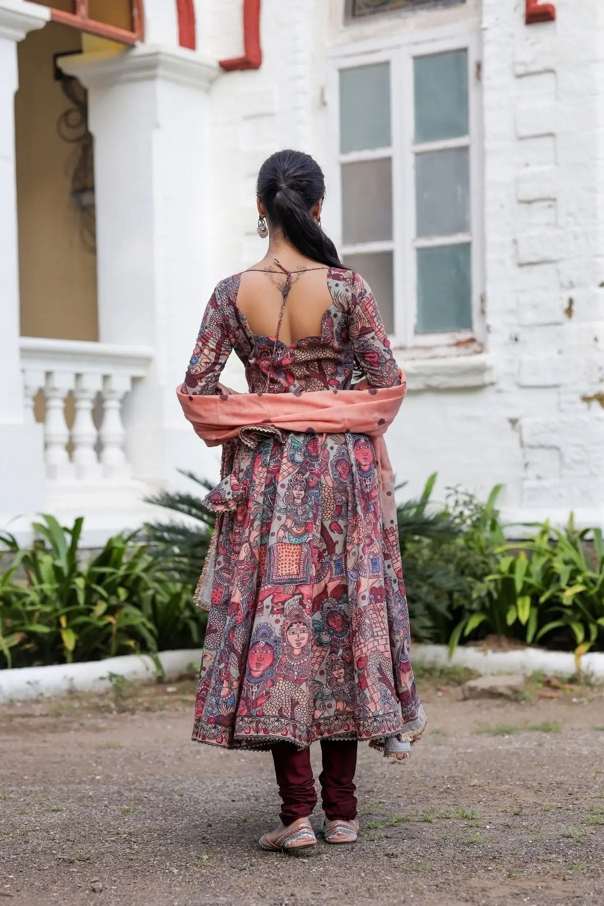 Back view of maroon Kuhu Anarkali dress with open design