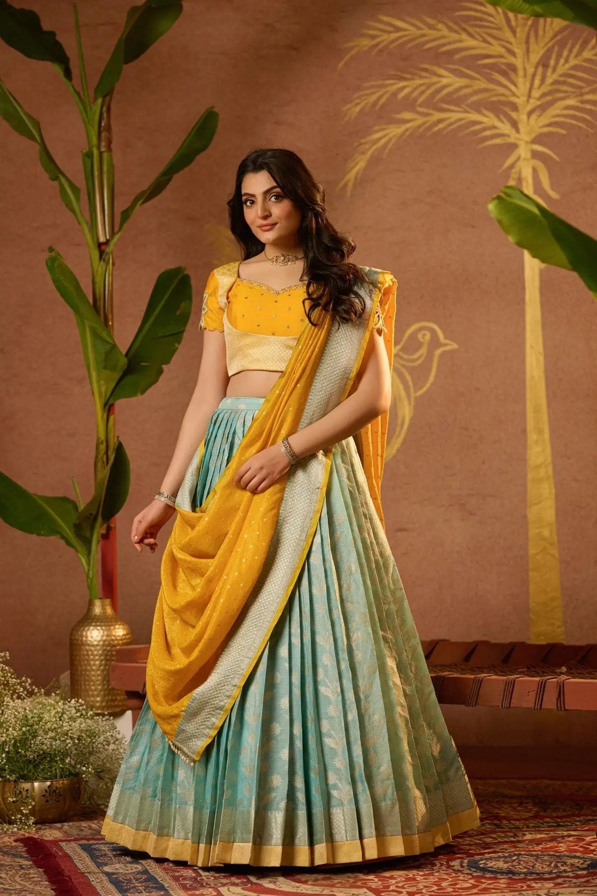 Stylish Aadhya Lehenga Set in Yellow with intricate embroidery and a pleated skirt, perfect for weddings and festivities. Buy now at bullionknot.