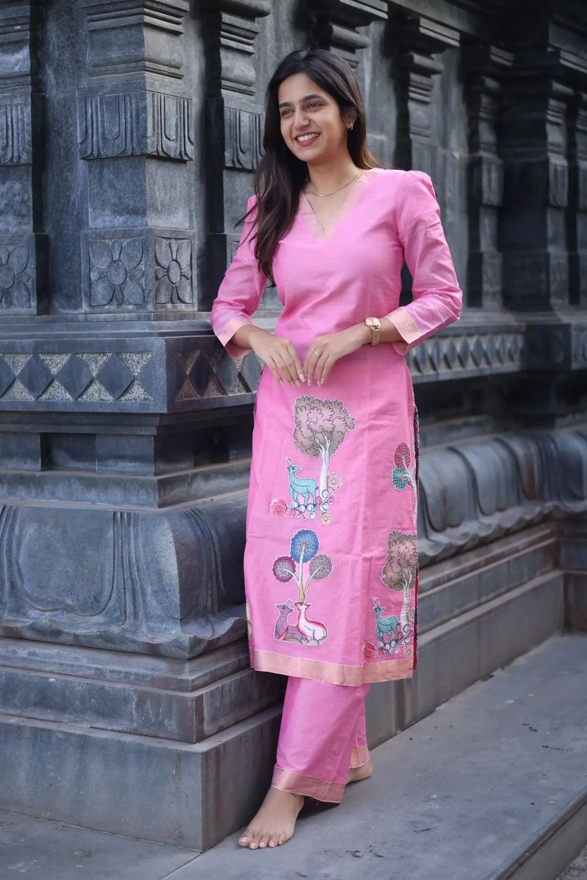 Side pose of the Chhaavi Kurta Set in Pink, emphasizing its flattering fit and exquisite embroidered patterns for a sophisticated look.