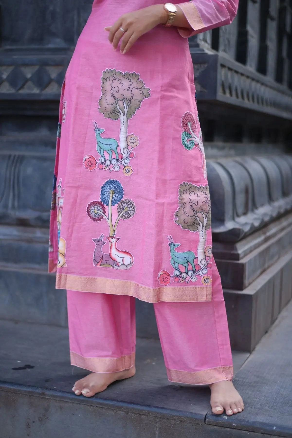 Close-up of the Chhaavi Kurta Set in Pink, showcasing detailed embroidery with nature-inspired motifs on soft fabric for a graceful look.