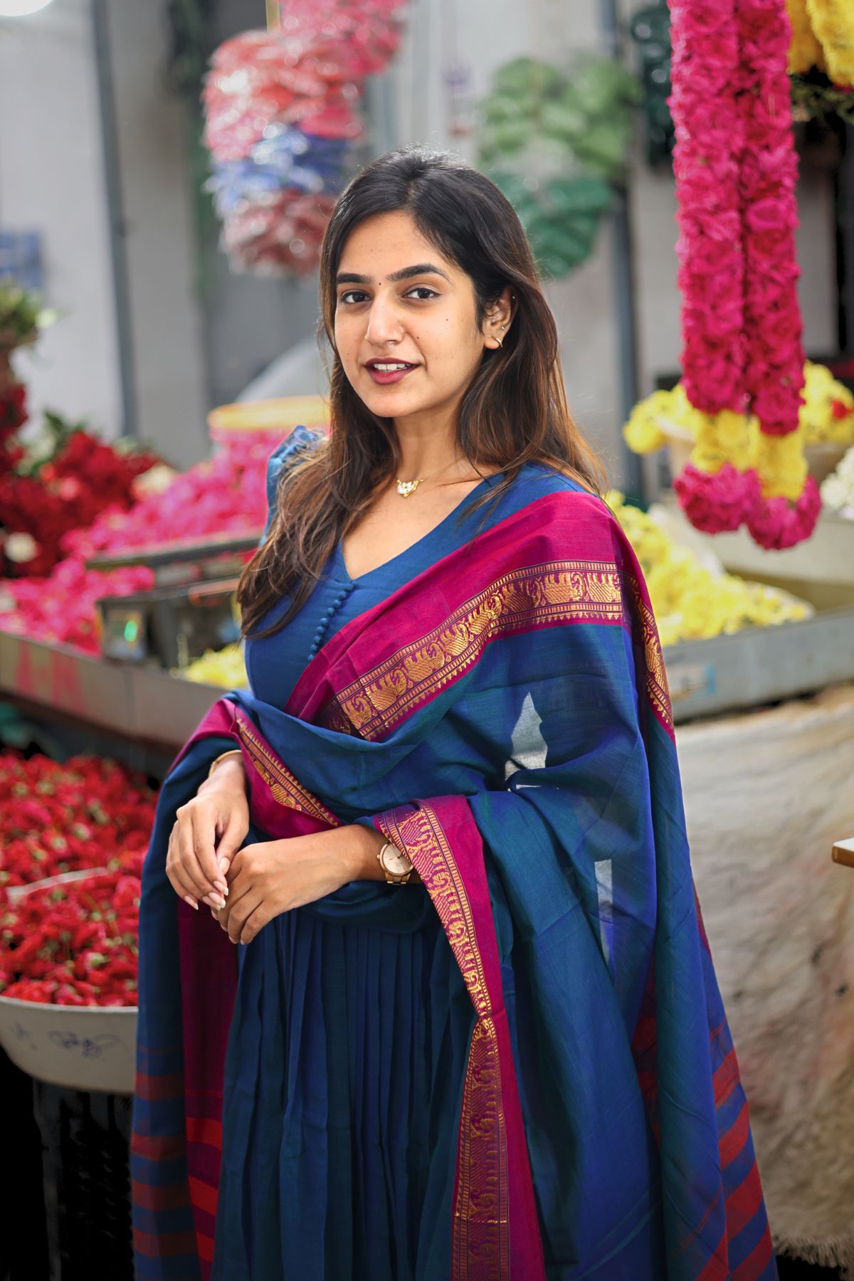 Graceful Saanchi Kurta Set in Peacock Blue with a vibrant dupatta featuring gold accents. A perfect traditional ensemble for festive occasions at bullionknot.