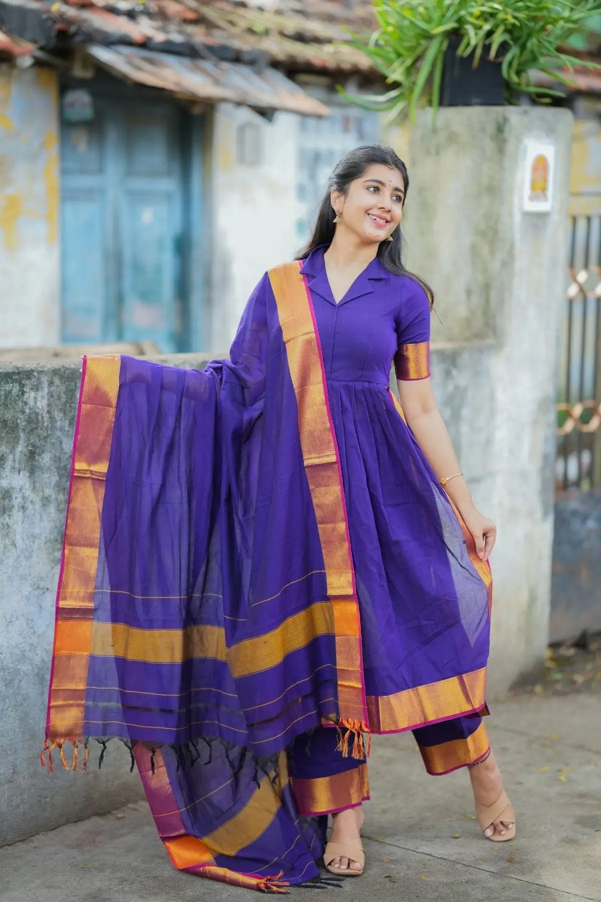 Flowing purple handloom suit set with intricate patterns