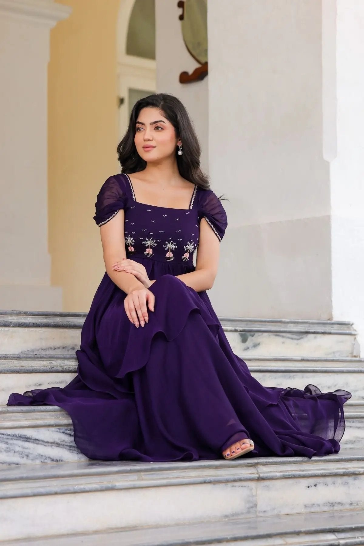 Prakshi Elegant Gown in Purple, seated pose