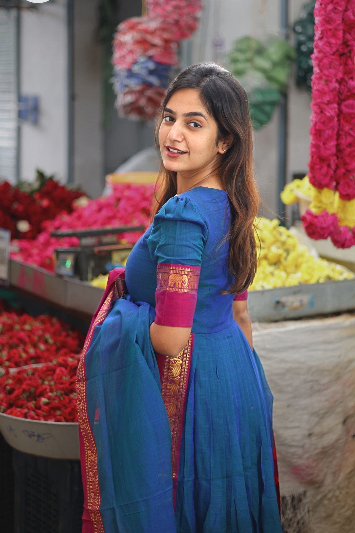 Back view of Saanchi Kurta Set in Peacock Blue, showcasing the elegant pleats and gold detailing. Shop this traditional attire now at bullionknot.