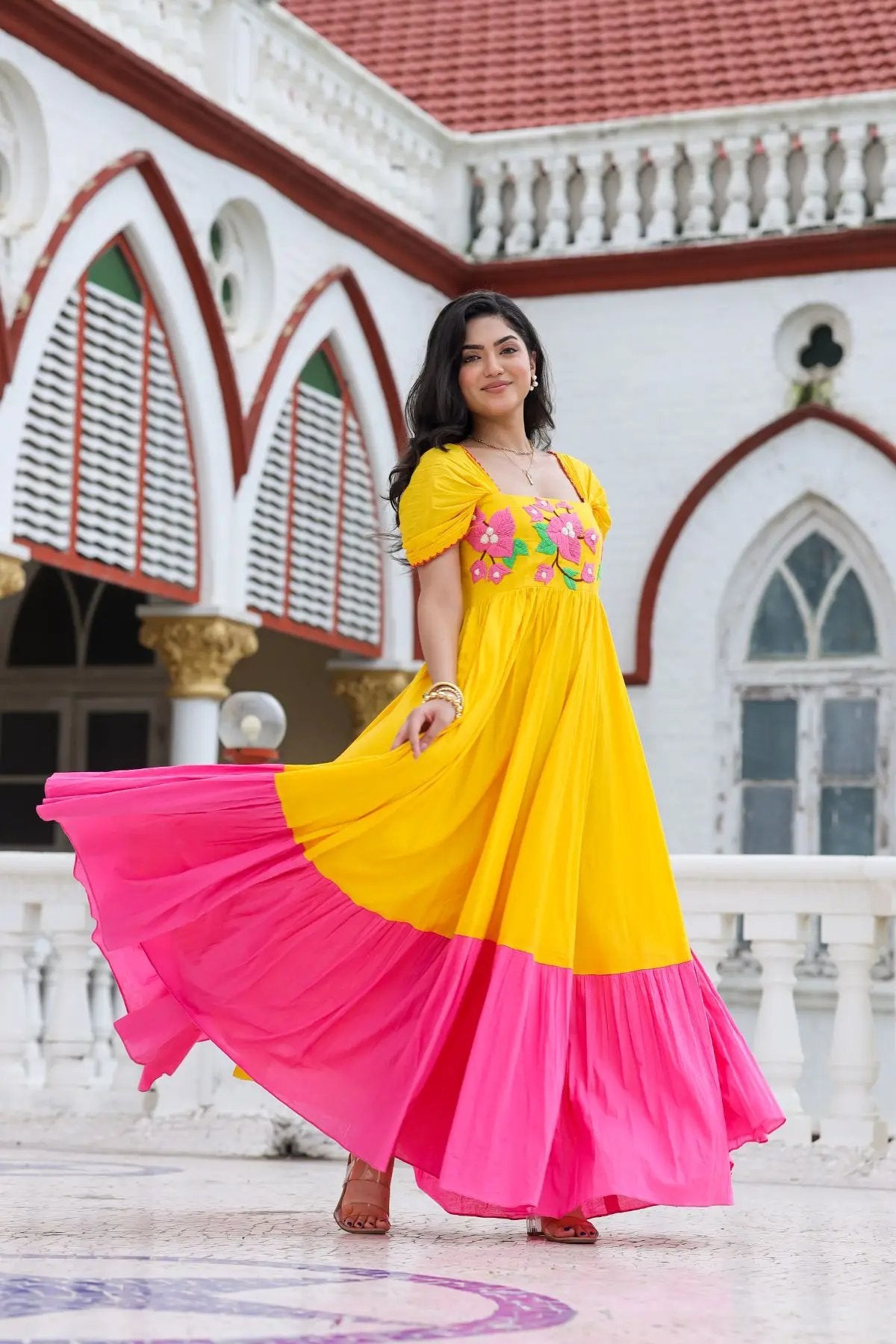 Flowing yellow and pink Daffodil Dream Maxi Dress in motion