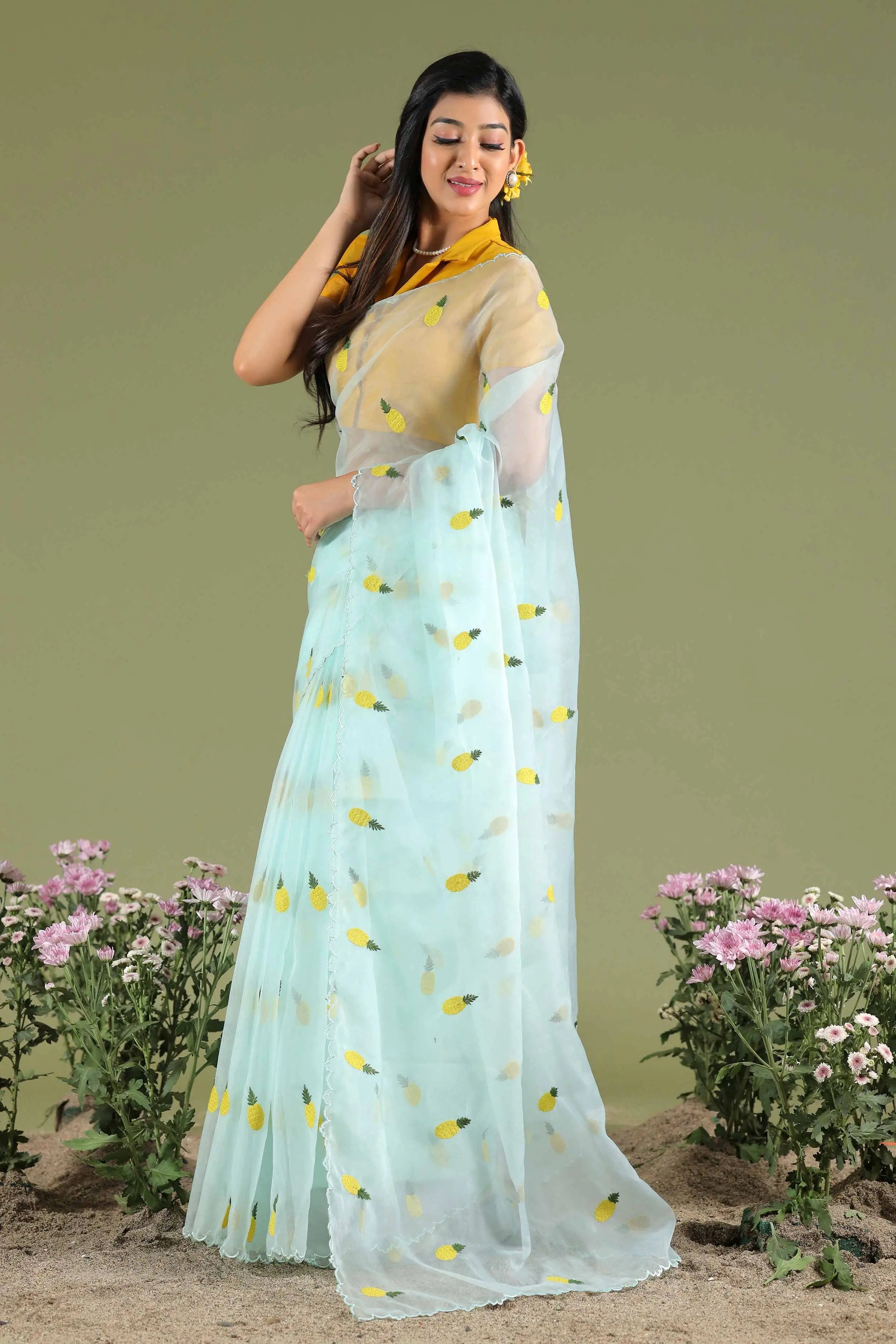 a woman in yellow and blue organza saree - Bullionknot