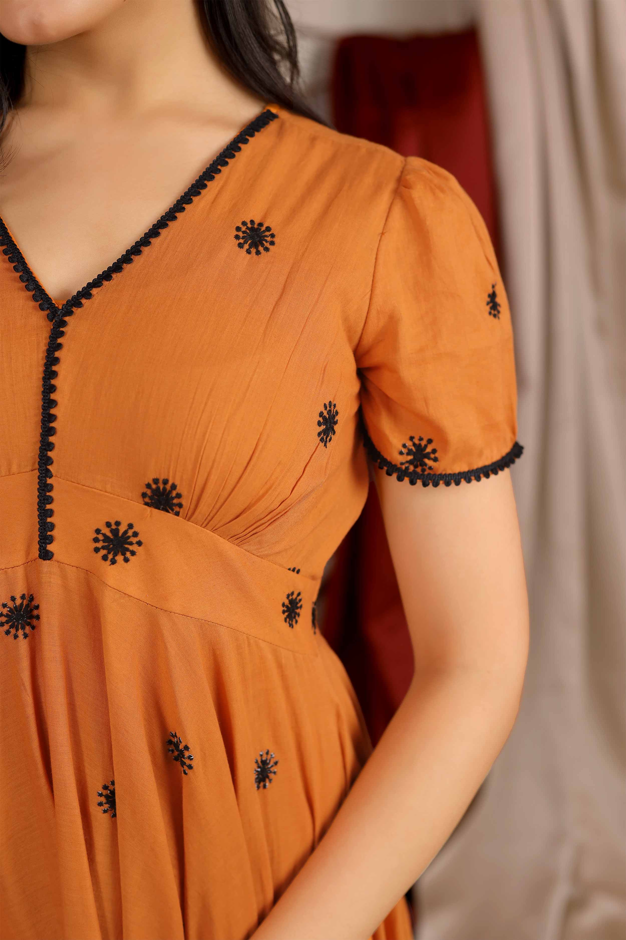 a woman in Apricot Summer Dress in Rust