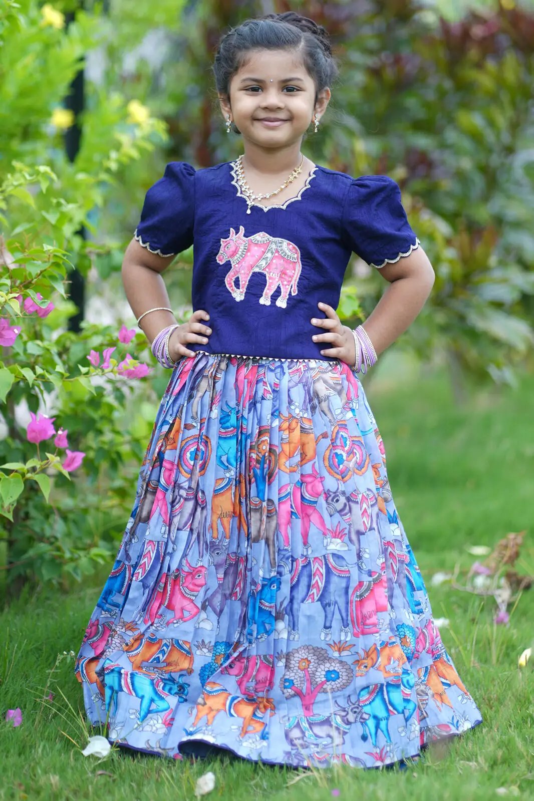 Child wearing colorful Baby Admiral Lehenga Set outdoors