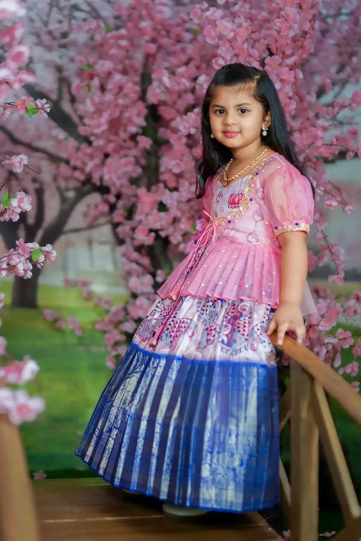 baby girl in pink dress