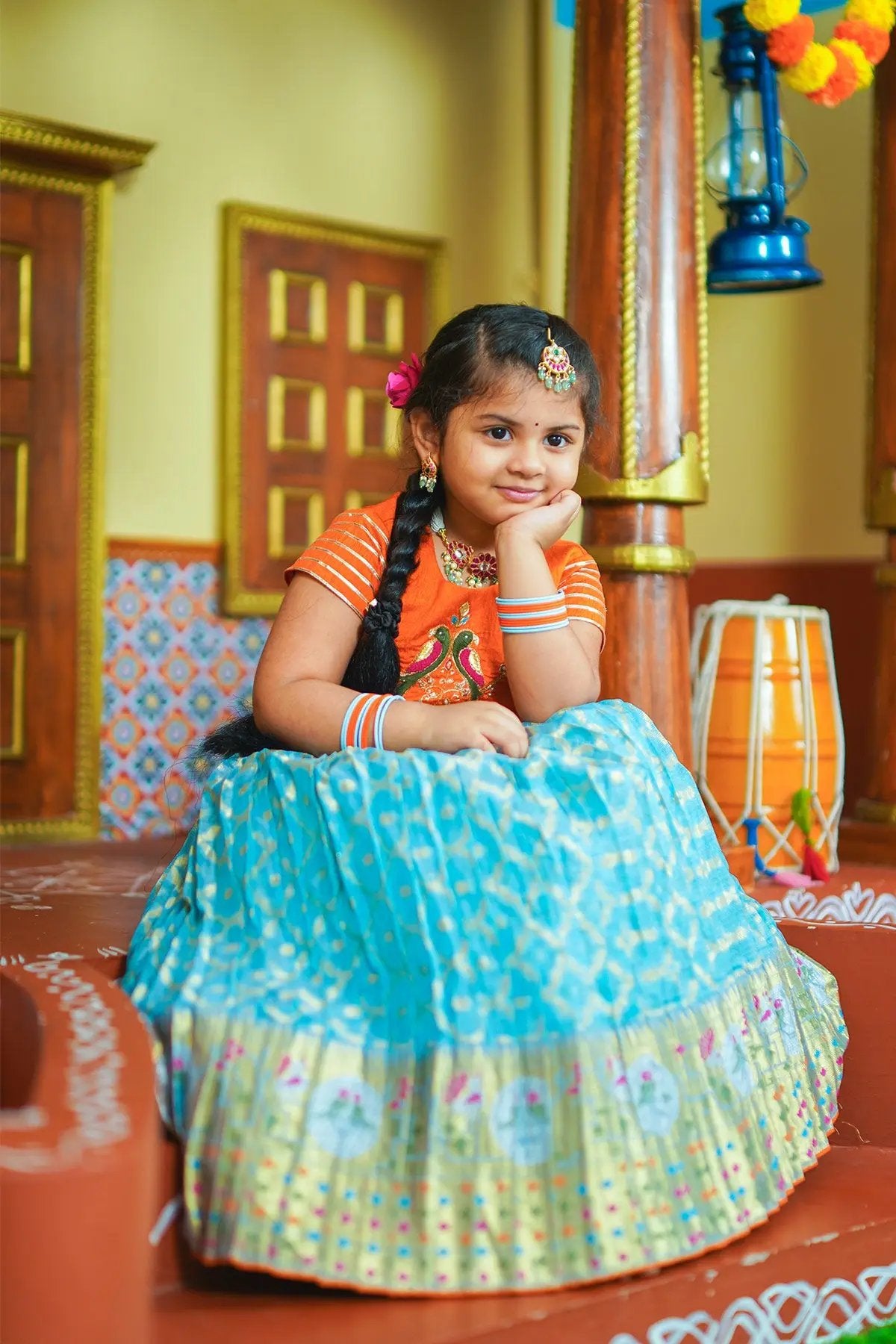 girl in orange and blue lehnga set